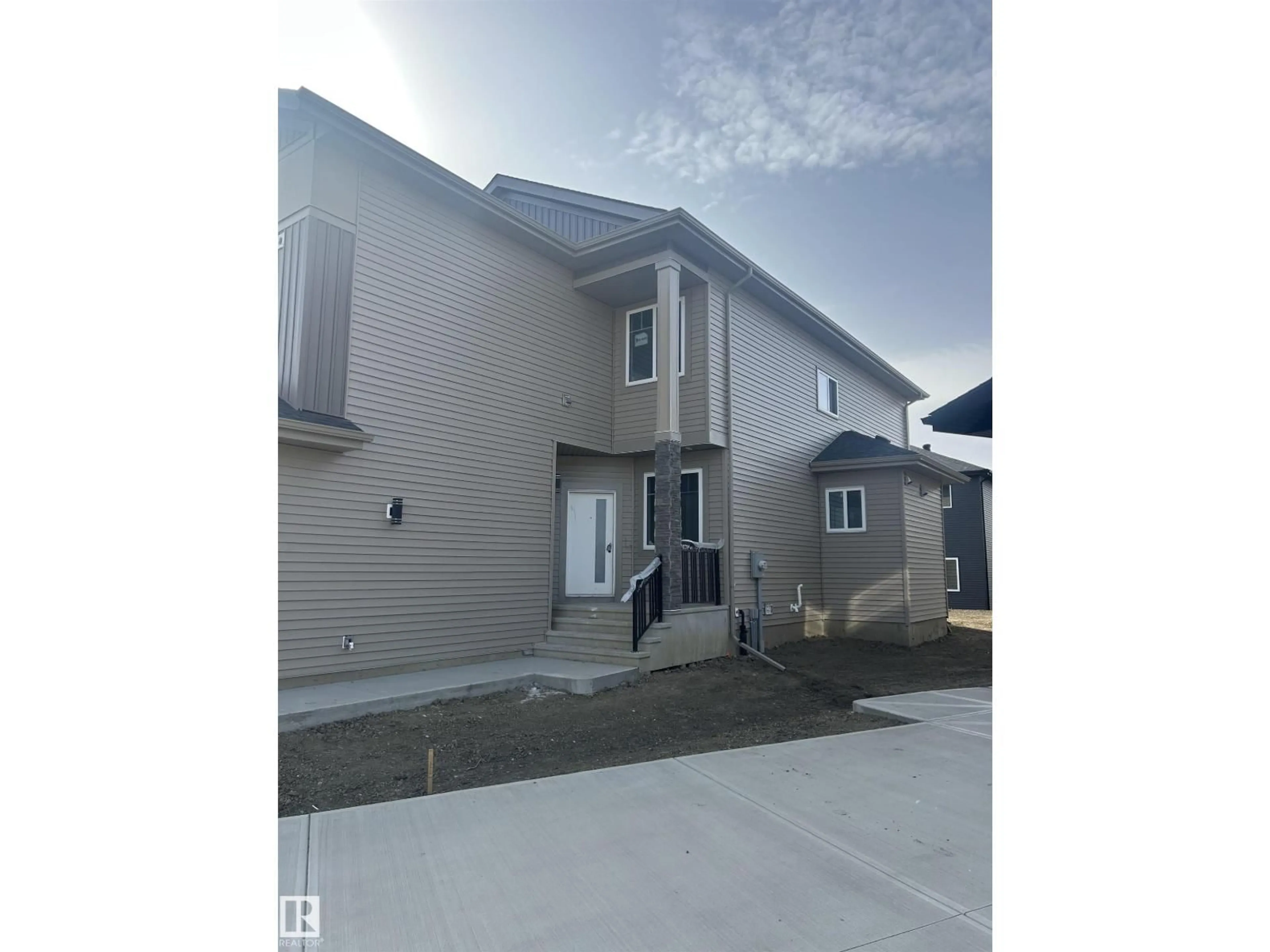 Home with vinyl exterior material, street for NE - 5924 18 ST, Rural Leduc County Alberta T4X3C7