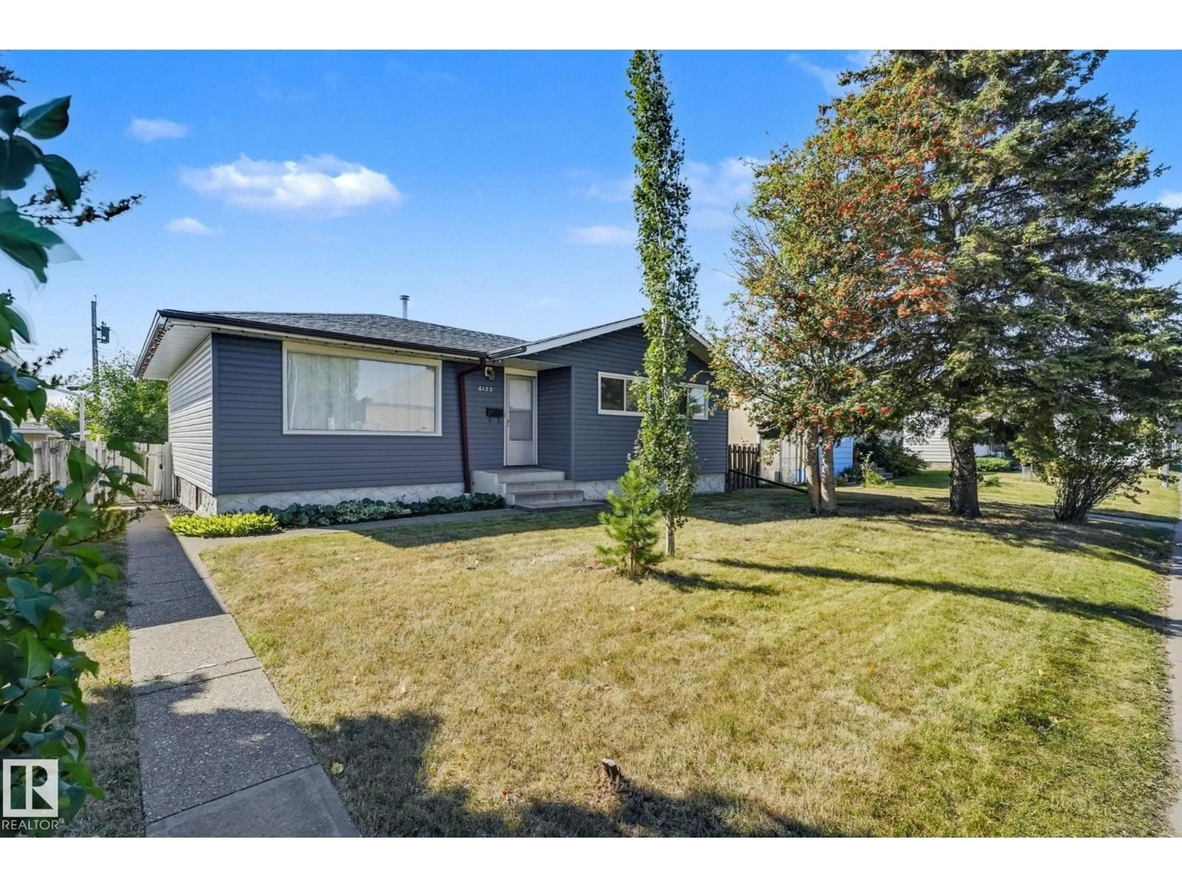 Home with vinyl exterior material, street for 6123 144 AV, Edmonton Alberta T5A1K8