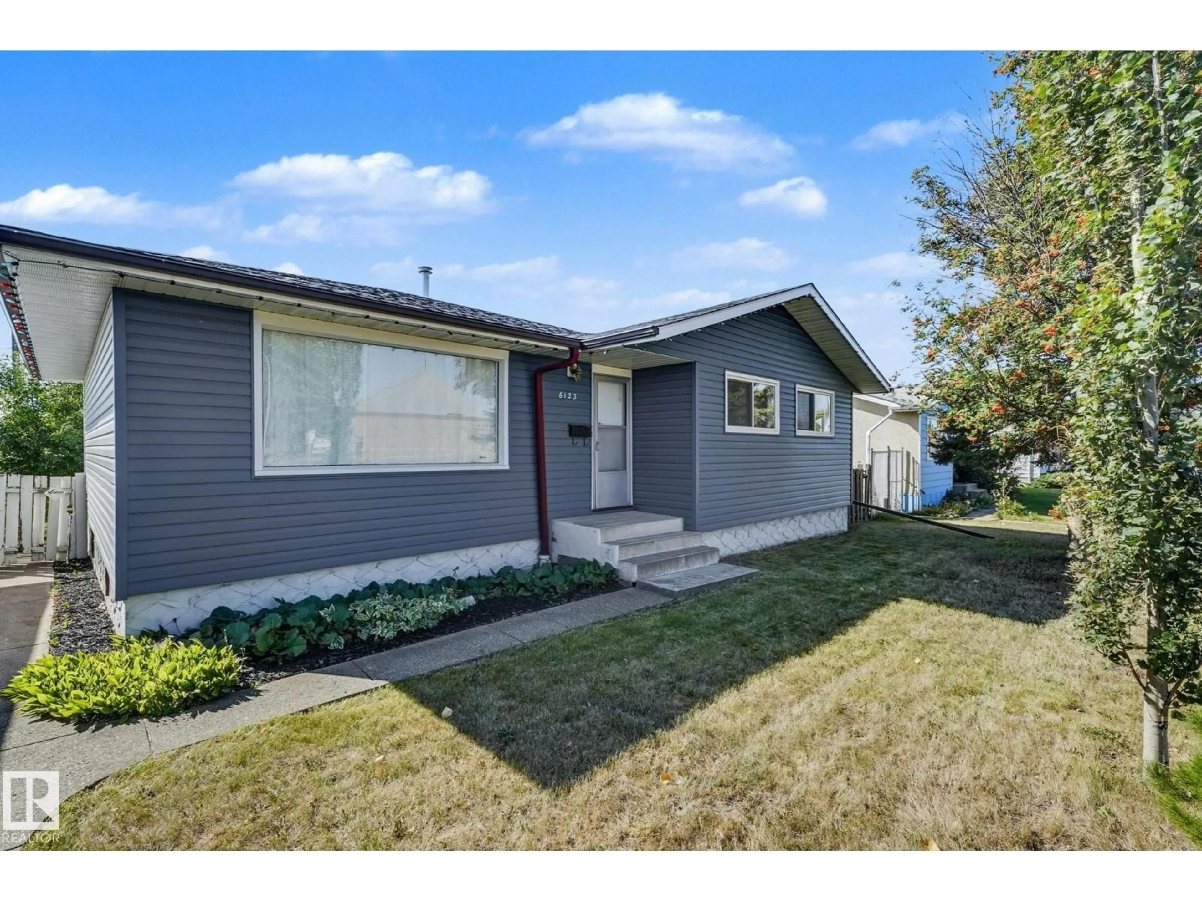 Home with vinyl exterior material, street for 6123 144 AV, Edmonton Alberta T5A1K8