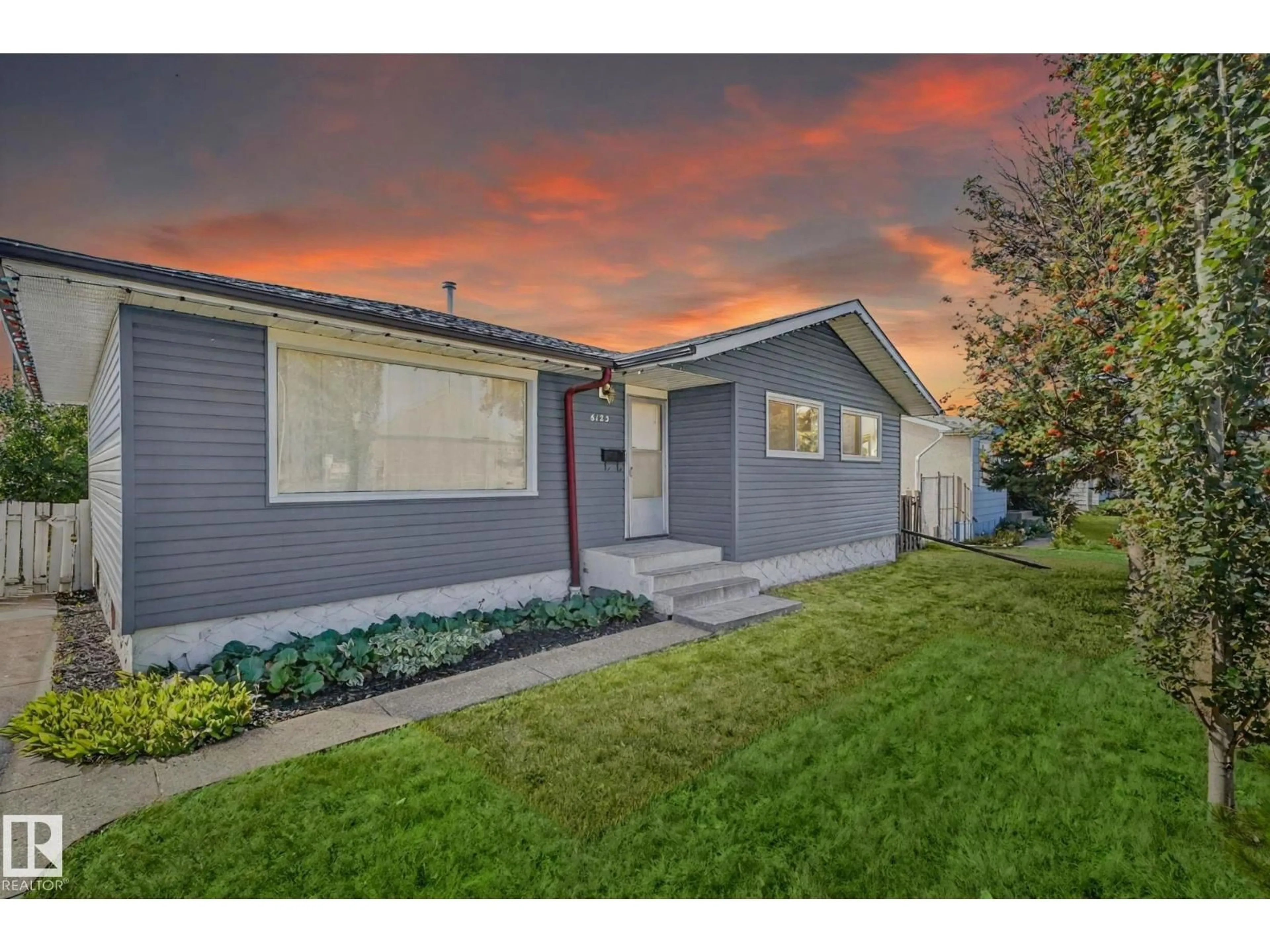 Home with vinyl exterior material, street for 6123 144 AV, Edmonton Alberta T5A1K8