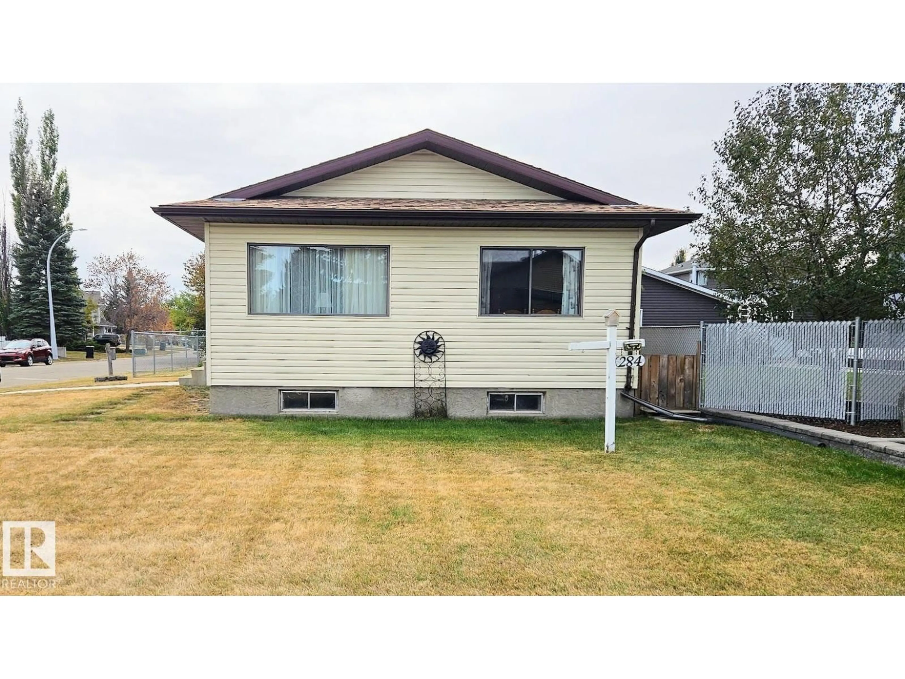 Home with vinyl exterior material, street for 284 PORTER AV, Millet Alberta T0C1Z0