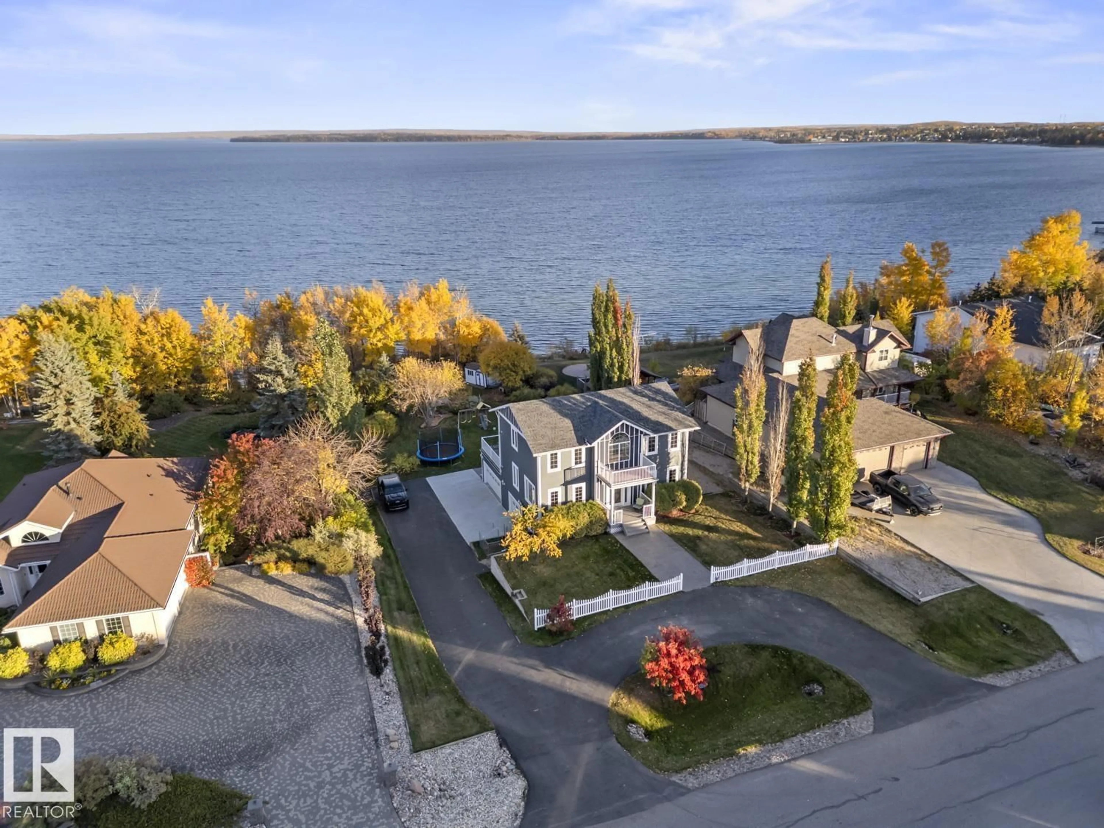 A pic from outside/outdoor area/front of a property/back of a property/a pic from drone, water/lake/river/ocean view for 1512 HORSESHOE BAY ES, Cold Lake Alberta T9M1G8