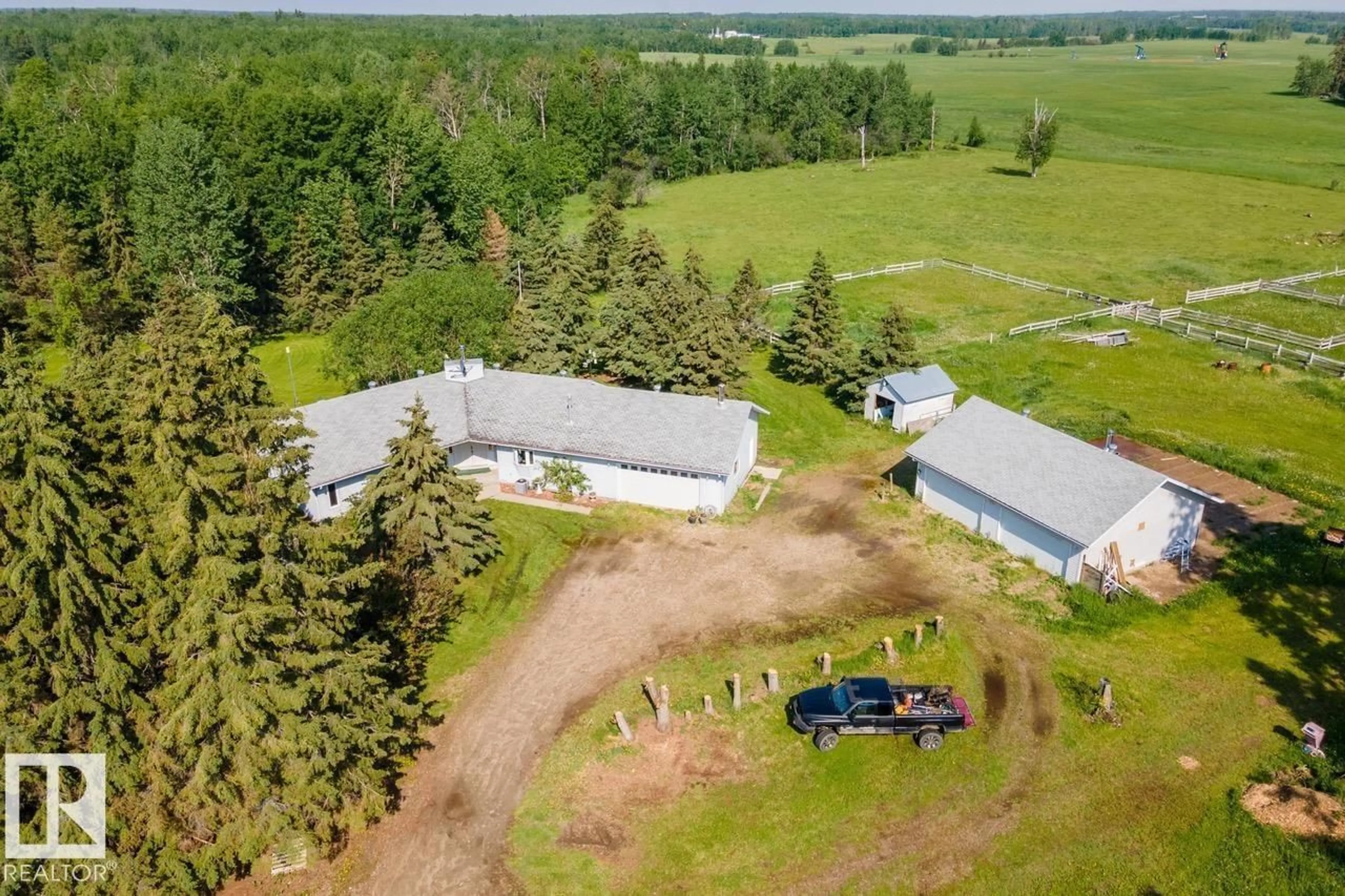 A pic from outside/outdoor area/front of a property/back of a property/a pic from drone, unknown for 55428 HWY 765, Cherhill Alberta T0E0J0