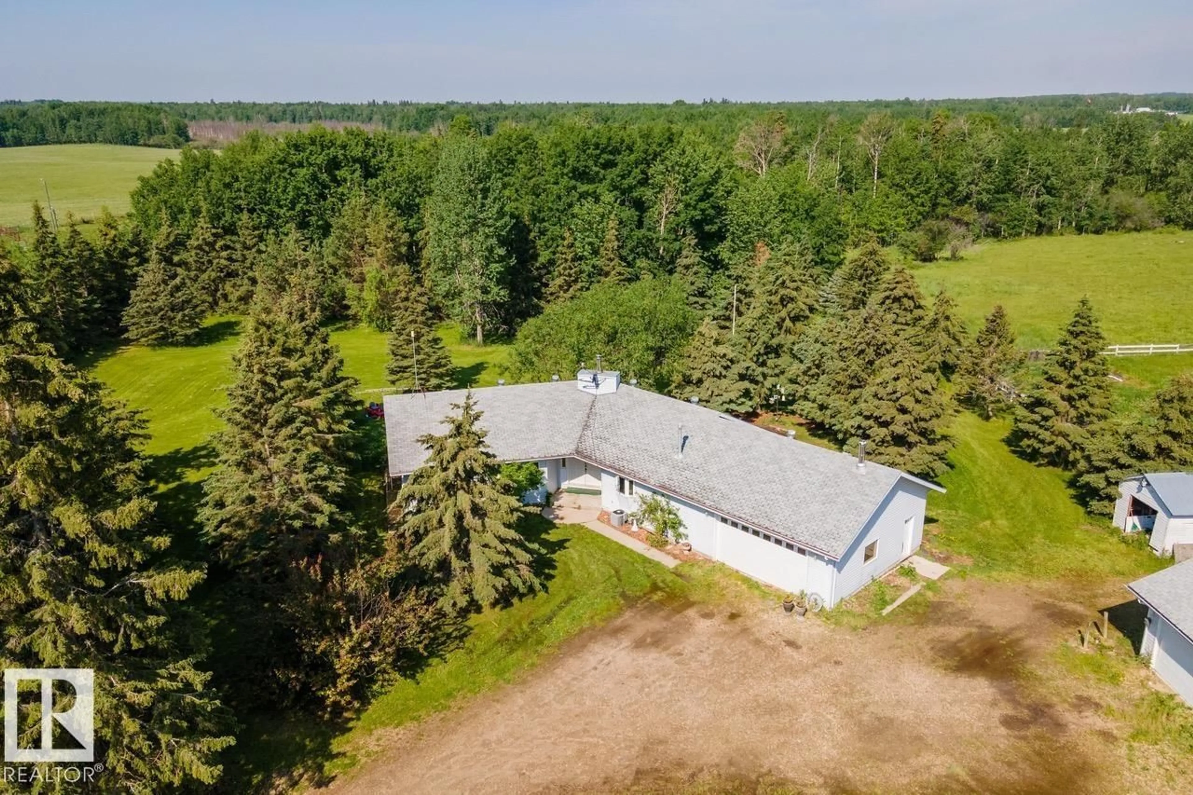 A pic from outside/outdoor area/front of a property/back of a property/a pic from drone, unknown for 55428 HWY 765, Cherhill Alberta T0E0J0