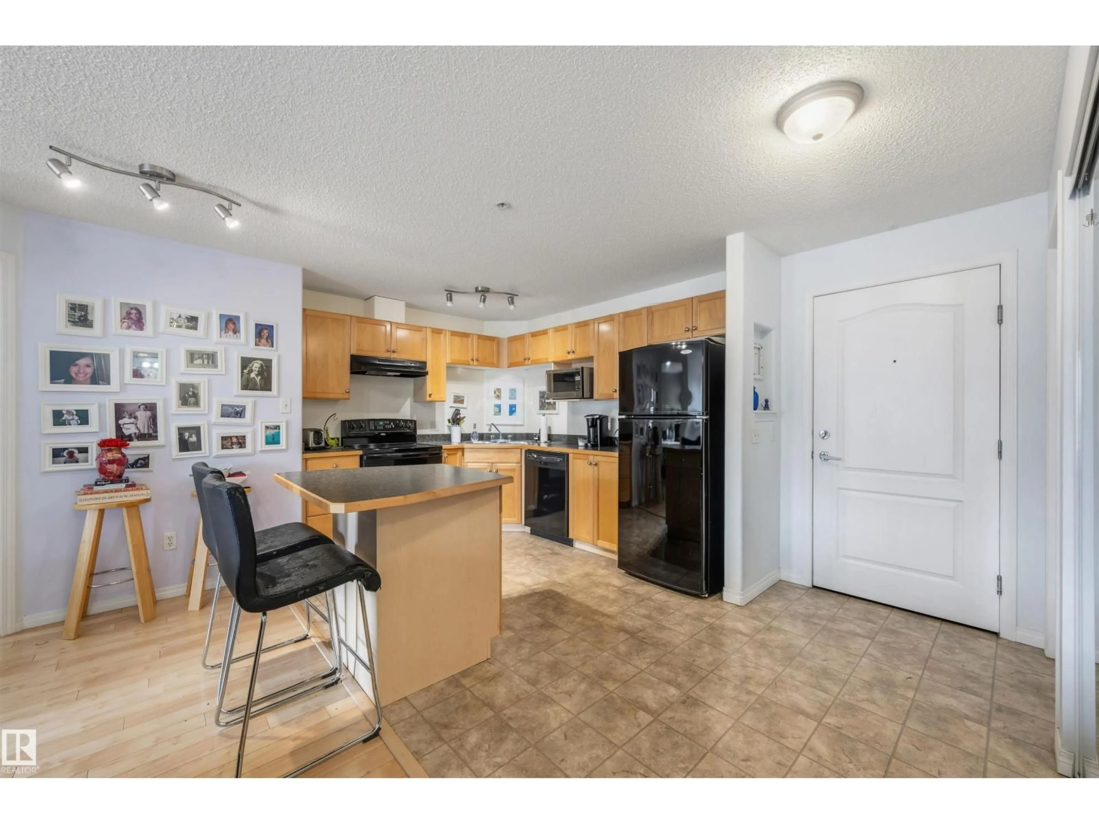 Open concept kitchen, ceramic/tile floor for 228 5350 199 ST NW, Edmonton Alberta T6M0A4