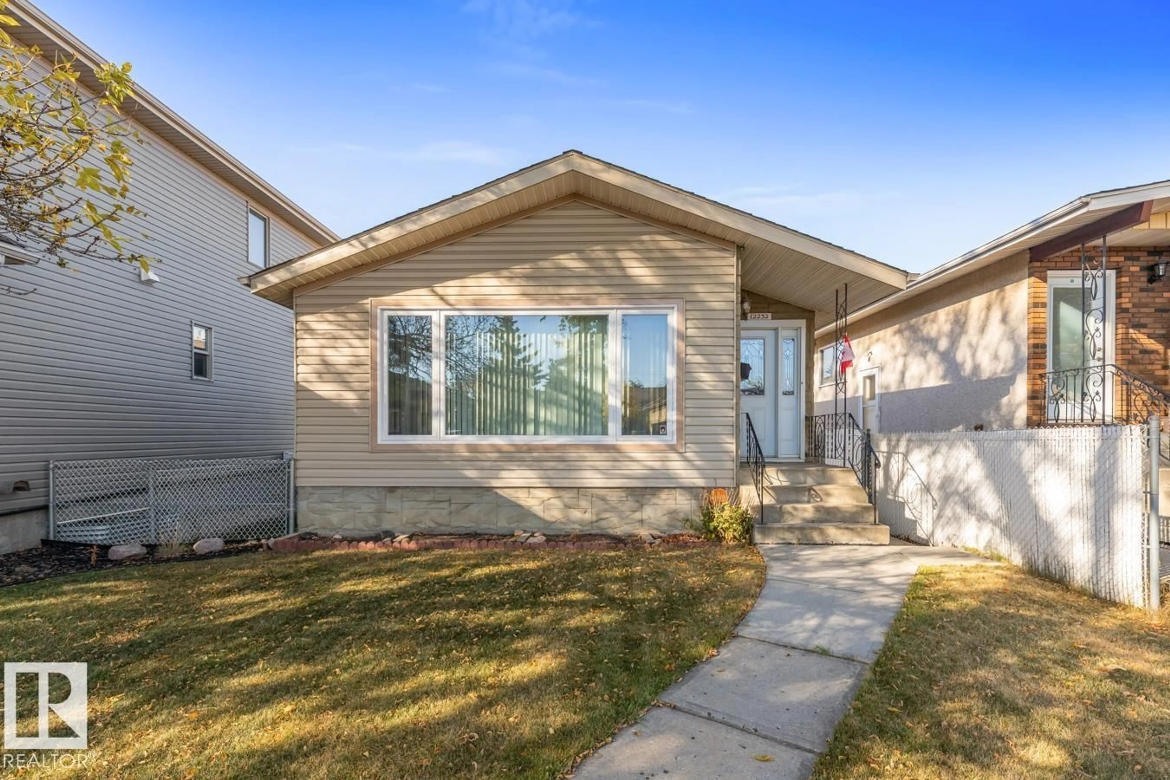 Home with vinyl exterior material, street for NW - 12232 83 ST, Edmonton Alberta T5B3A2