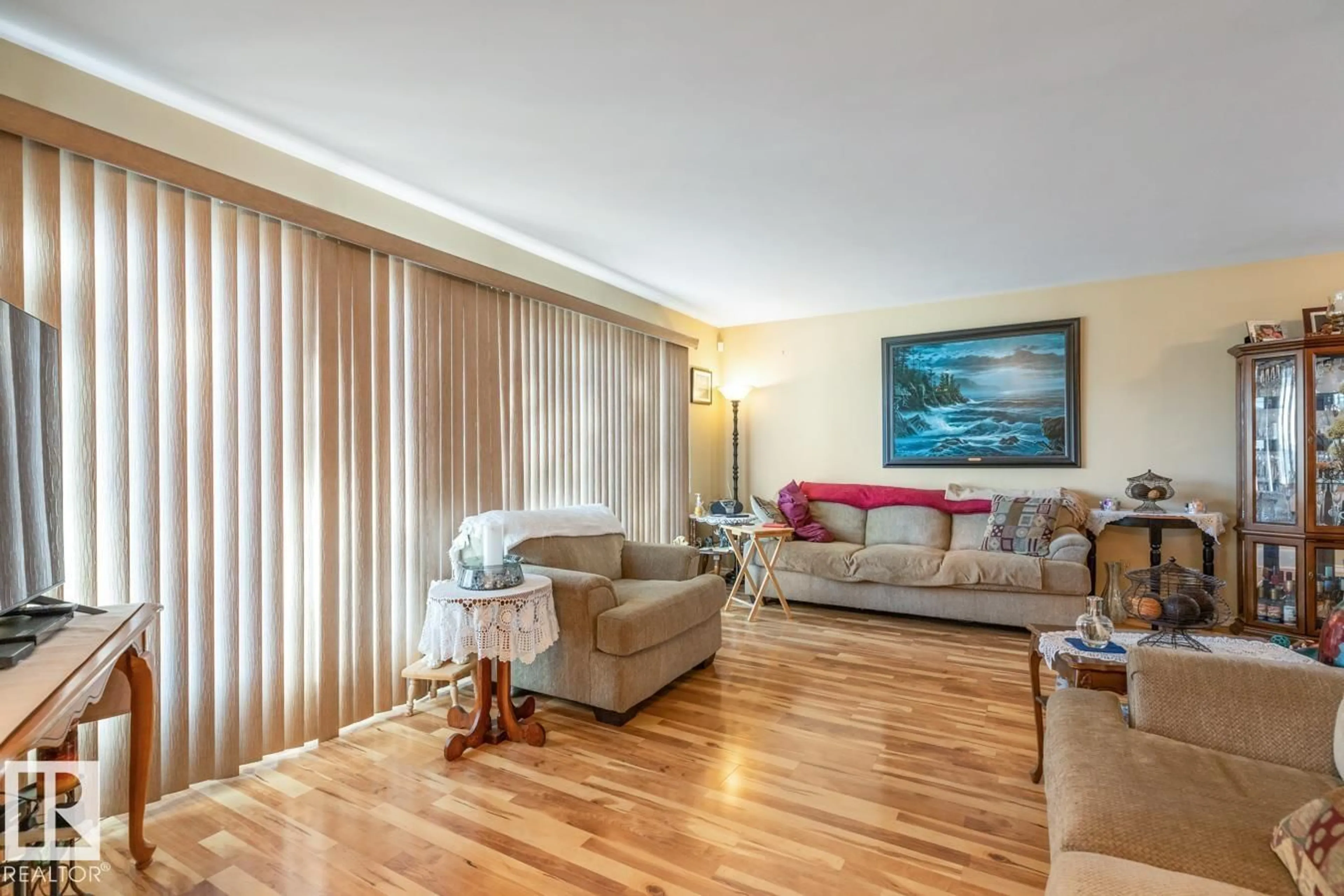 Living room with furniture, wood/laminate floor for NW - 12232 83 ST, Edmonton Alberta T5B3A2