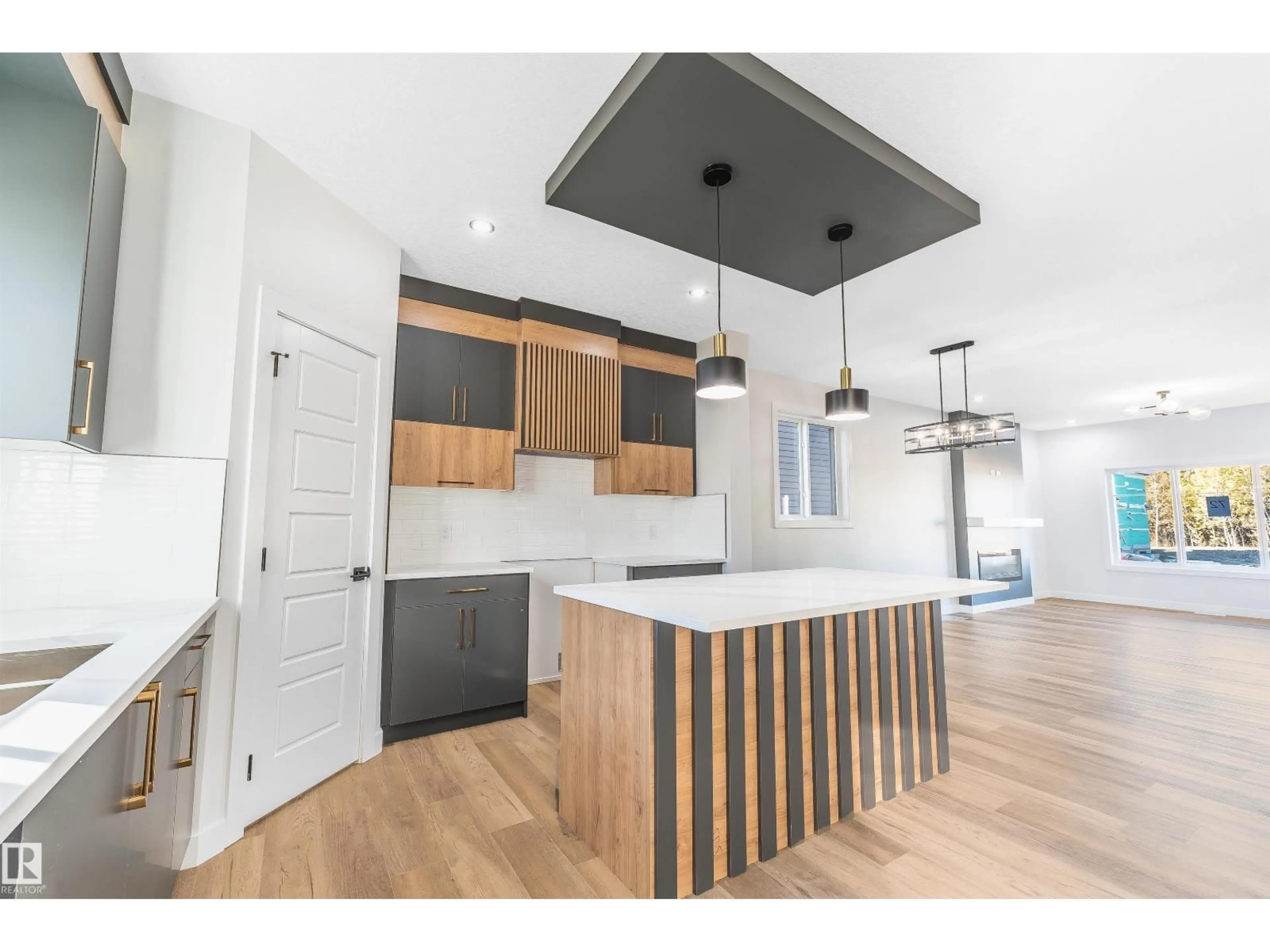 Open concept kitchen, wood/laminate floor for 72 PATRIOT WAY, Spruce Grove Alberta T7X2W6