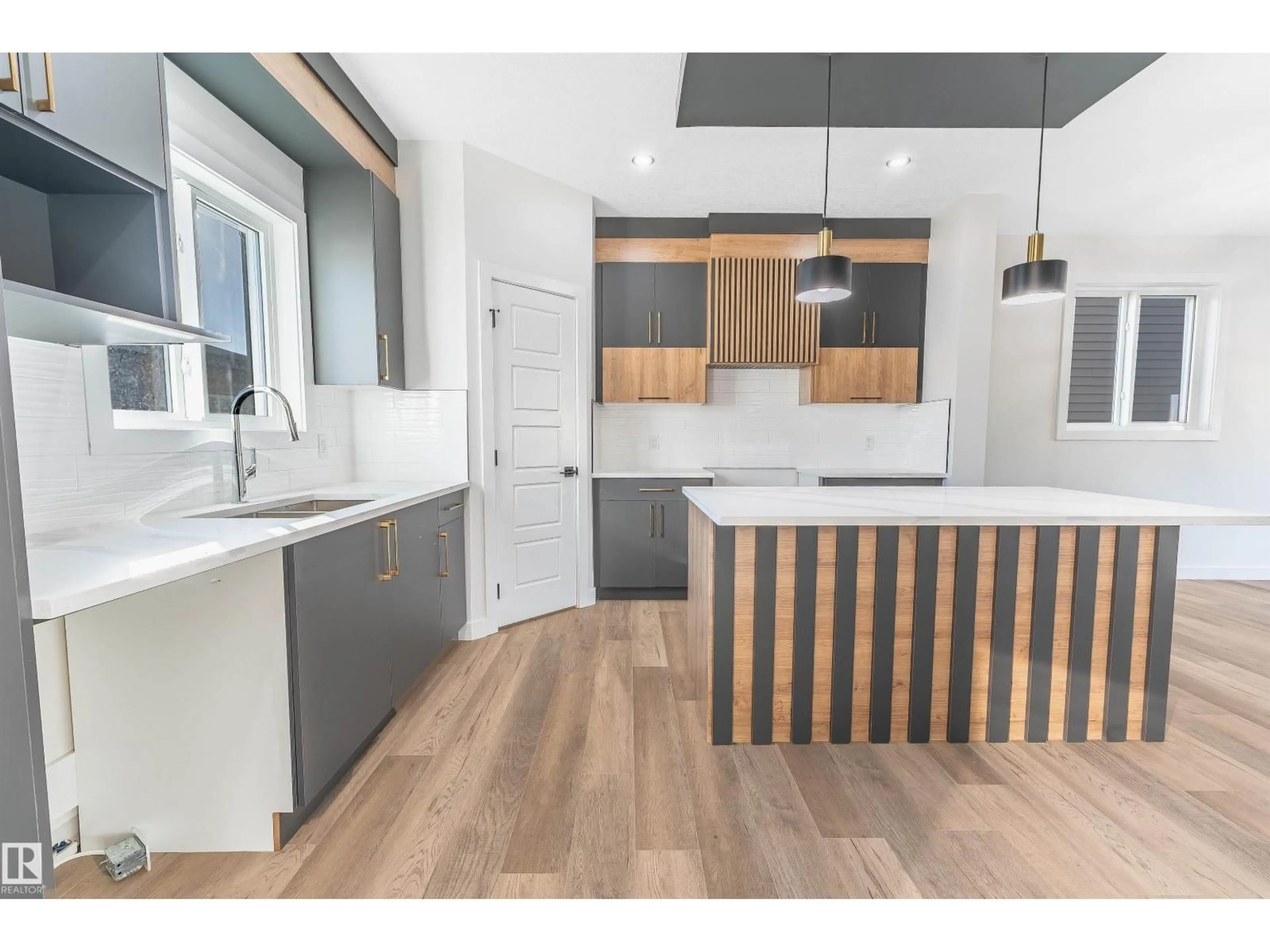 Open concept kitchen, wood/laminate floor for 72 PATRIOT WAY, Spruce Grove Alberta T7X2W6