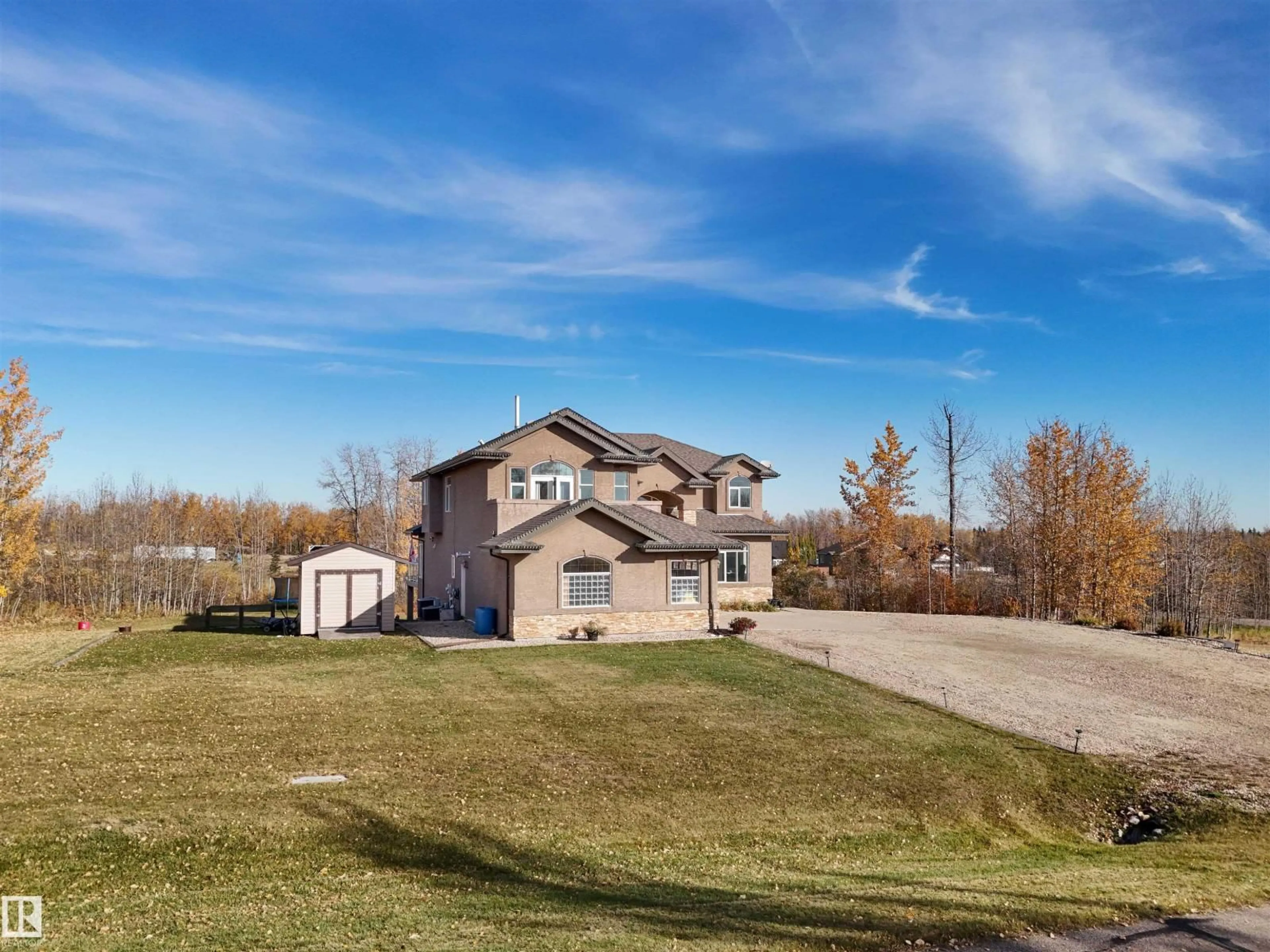 A pic from outside/outdoor area/front of a property/back of a property/a pic from drone, unknown for 302 49119 RGE RD 73, Rural Brazeau County Alberta T7A0B9