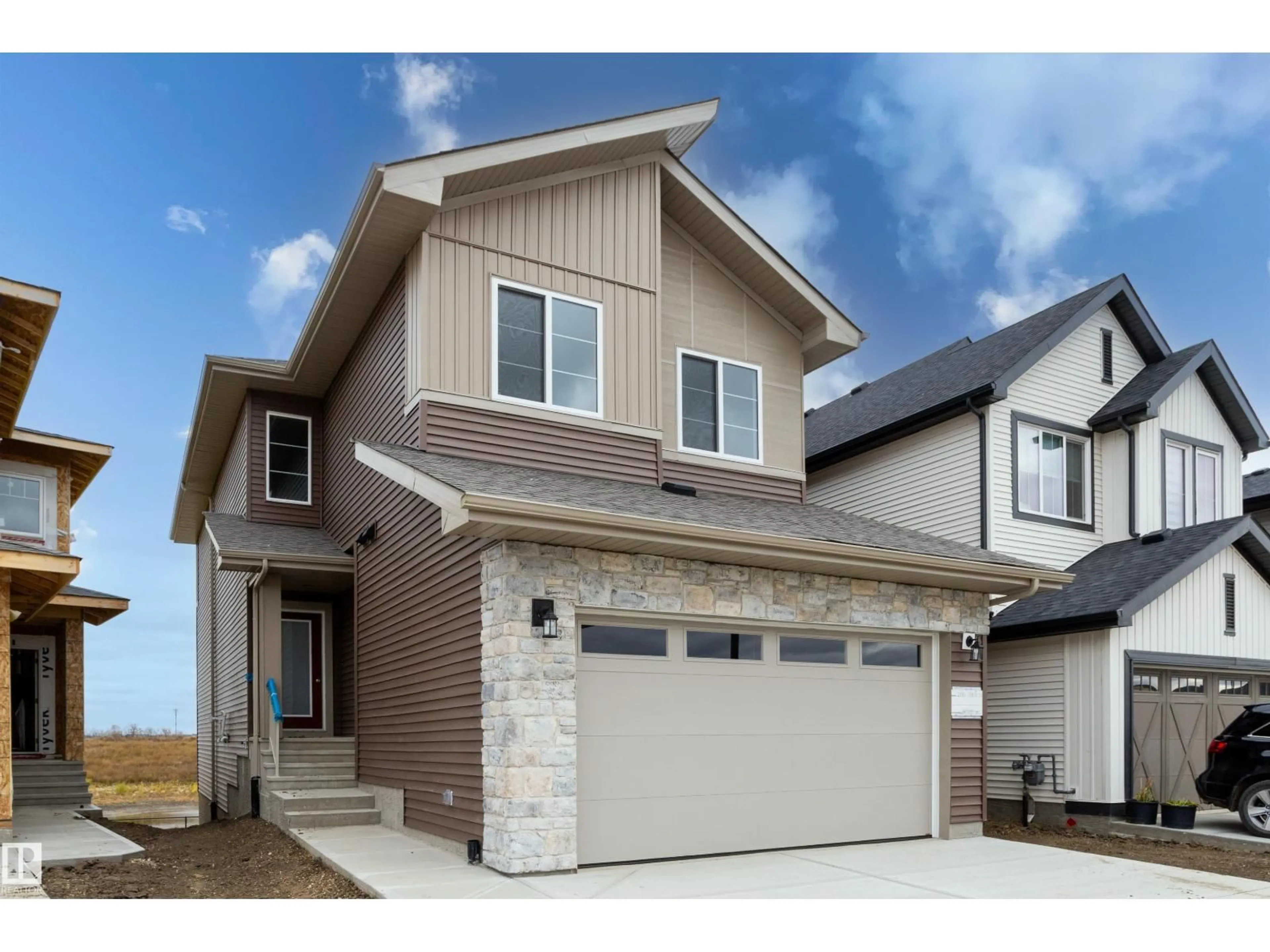 Home with vinyl exterior material, street for 2831 188 ST, Edmonton Alberta T6M3C5