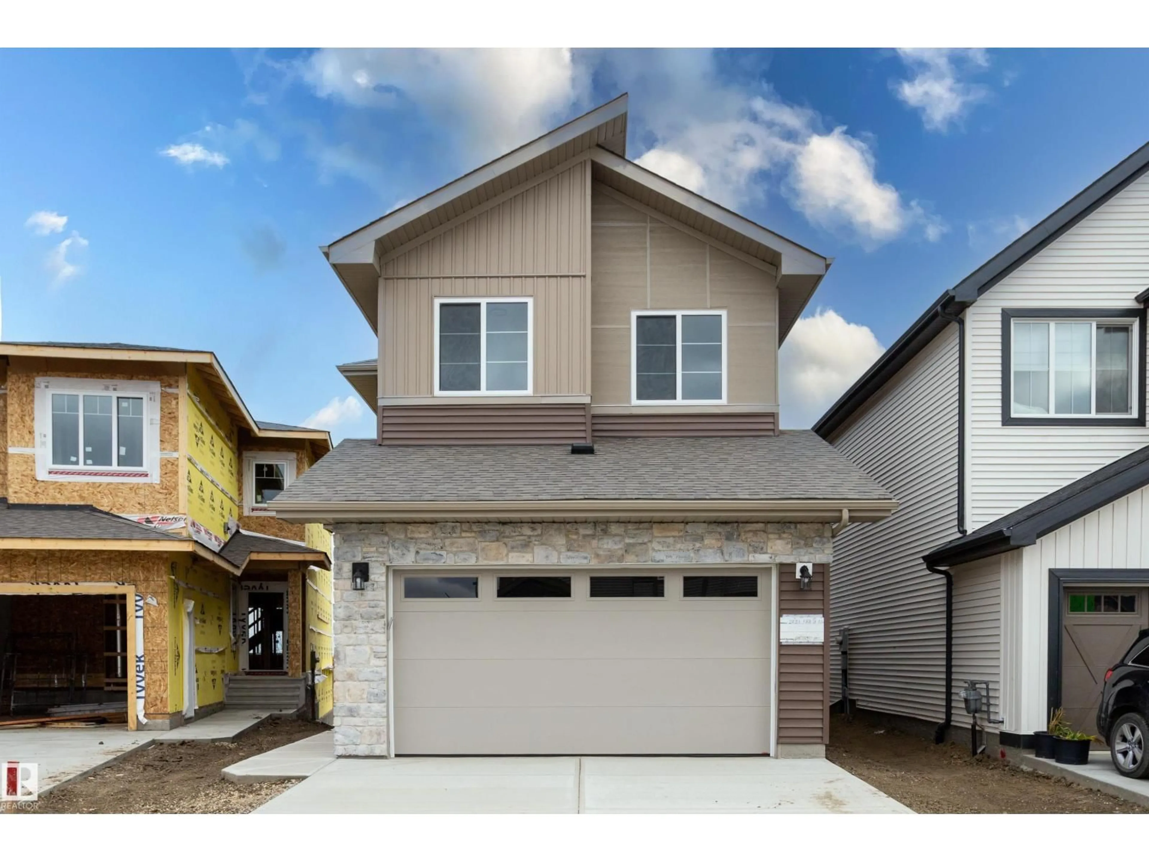 Home with vinyl exterior material, street for 2831 188 ST, Edmonton Alberta T6M3C5