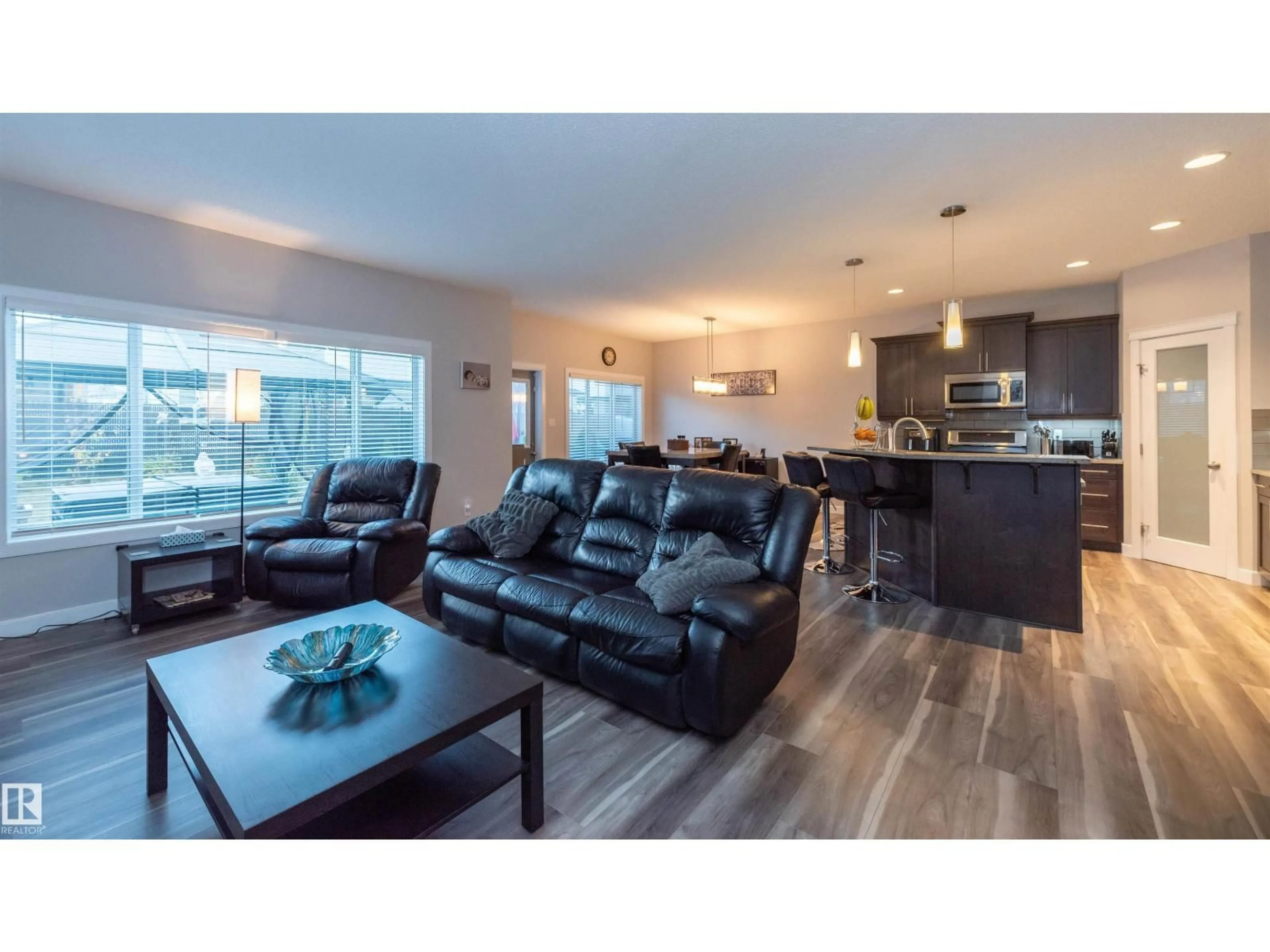Living room with furniture, wood/laminate floor for NW - 16728 60 ST, Edmonton Alberta T5Y0W6