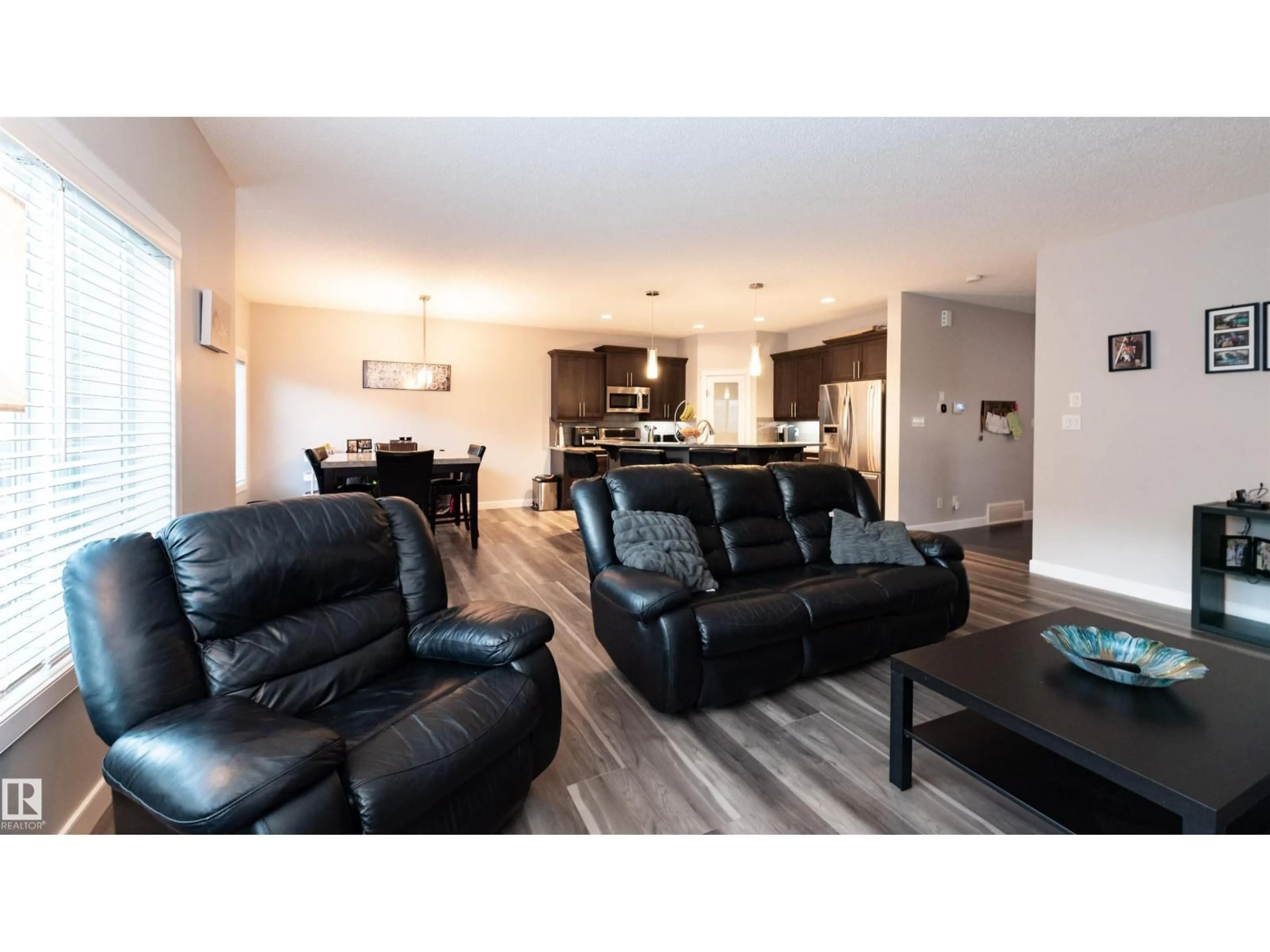 Living room with furniture, wood/laminate floor for NW - 16728 60 ST, Edmonton Alberta T5Y0W6