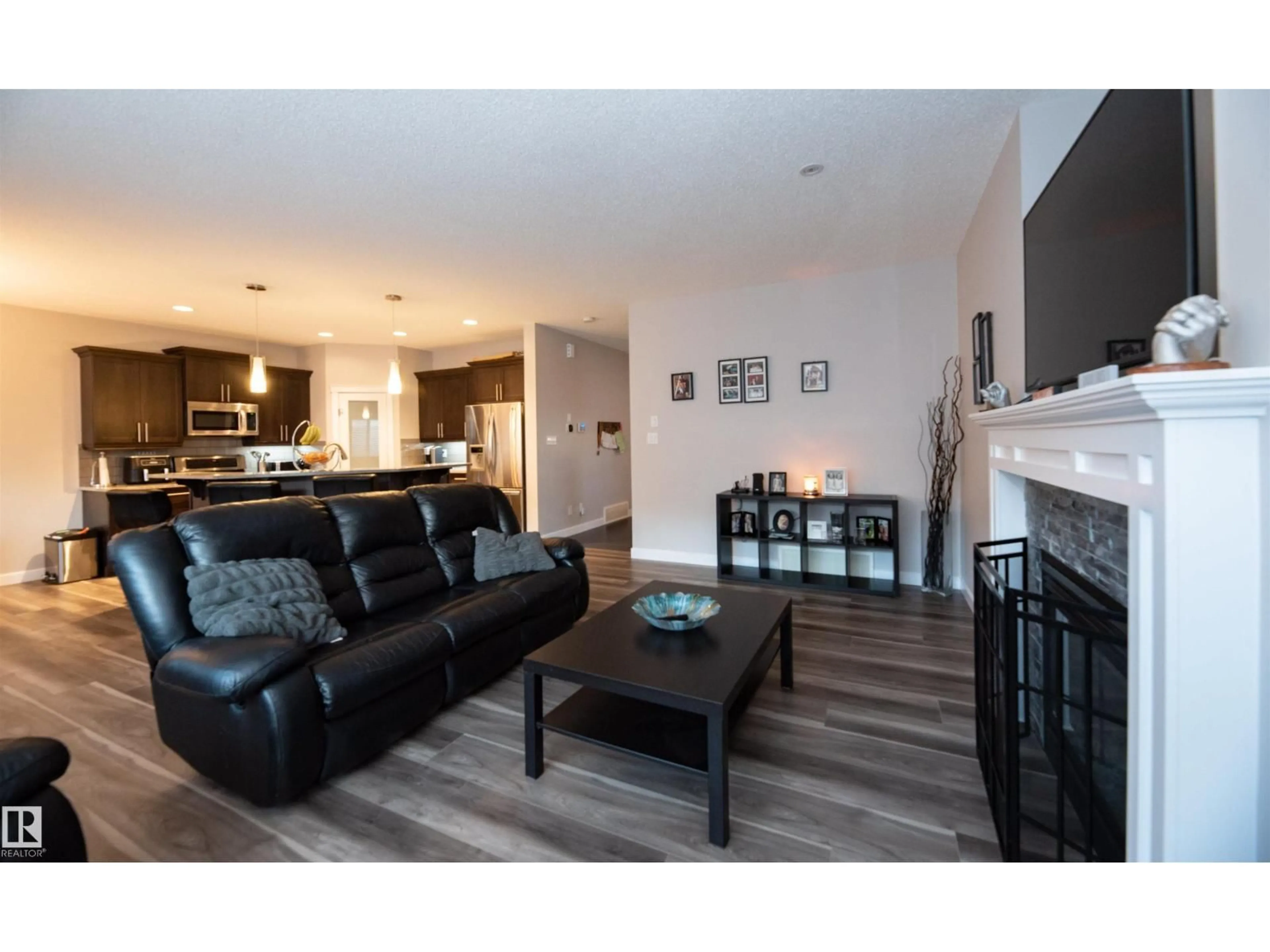 Living room with furniture, wood/laminate floor for NW - 16728 60 ST, Edmonton Alberta T5Y0W6