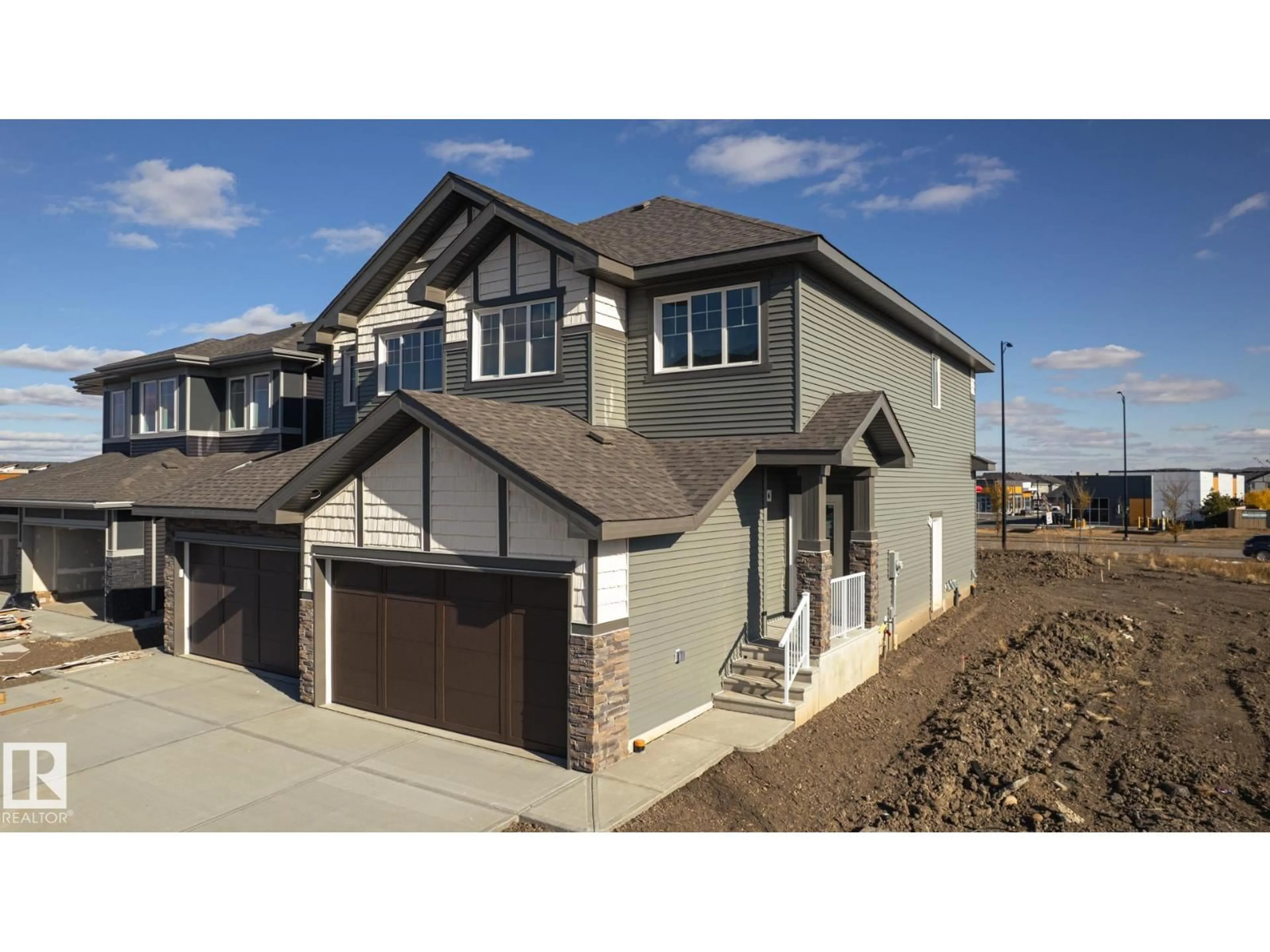 Home with vinyl exterior material, street for 17615 67 ST, Edmonton Alberta T5Z0W6