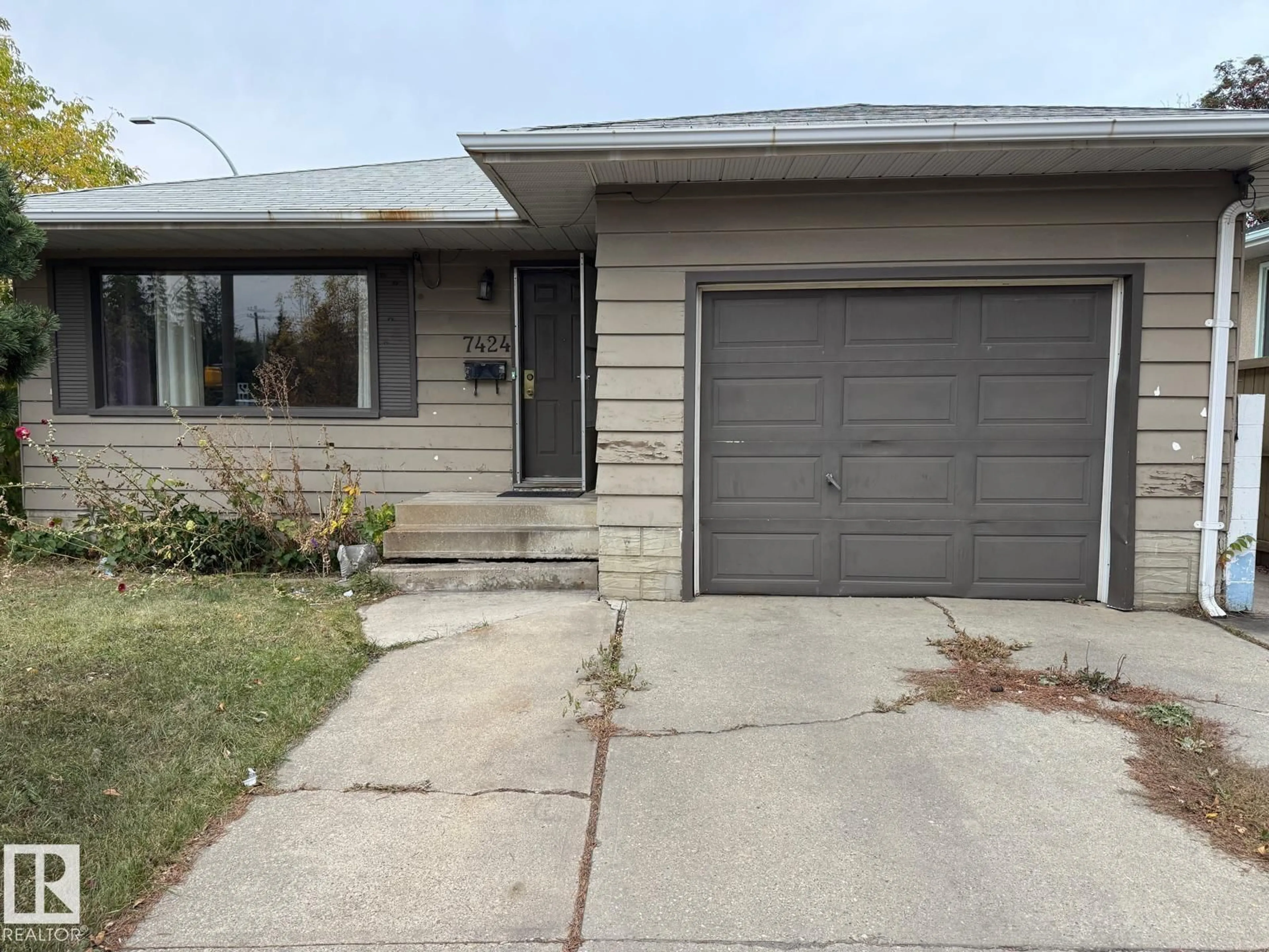 Home with vinyl exterior material, street for 7424 86 AVE, Edmonton Alberta T6B0K7
