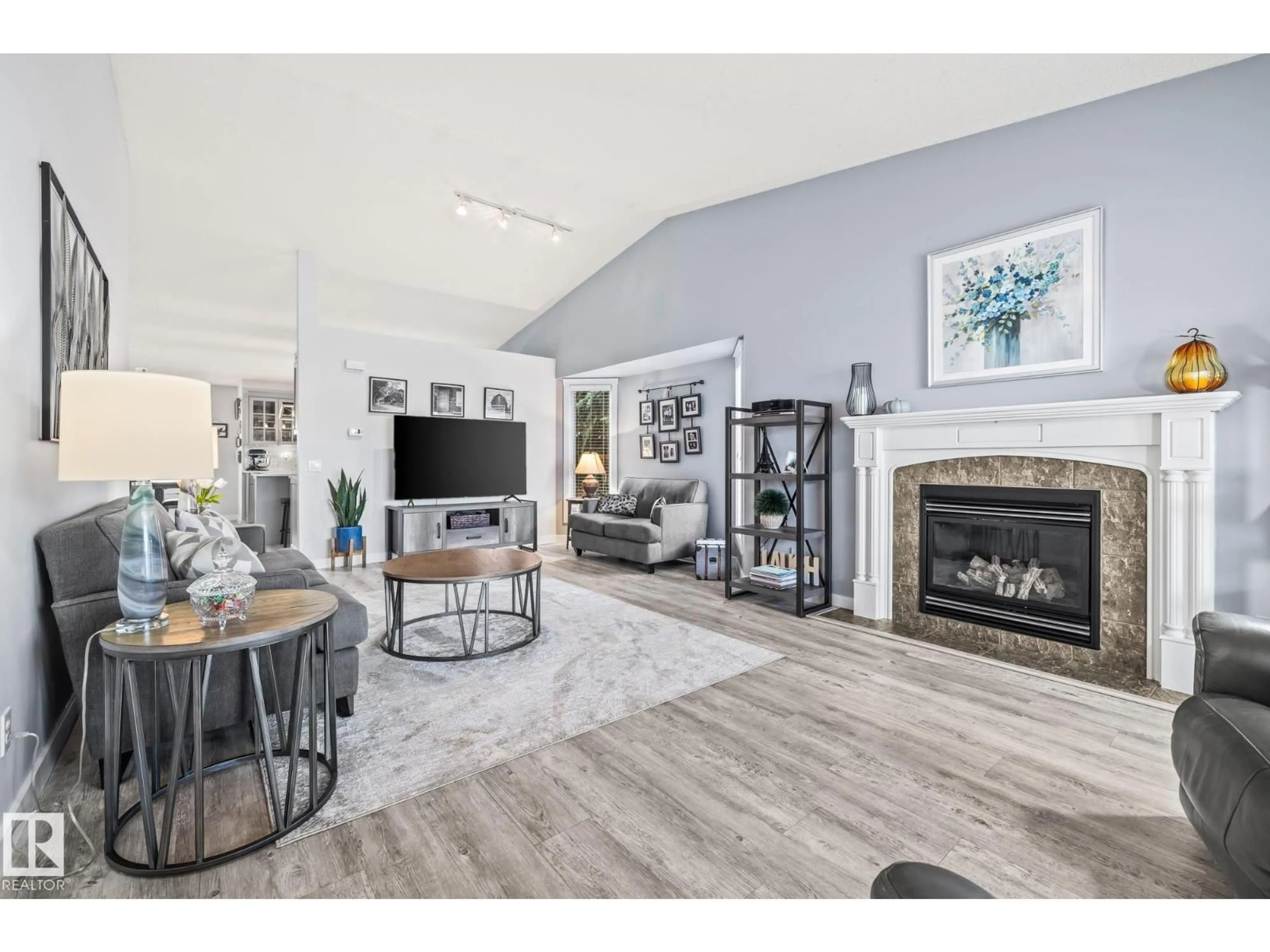Living room with furniture, wood/laminate floor for NW - 18931 89 AV, Edmonton Alberta T5T6B7