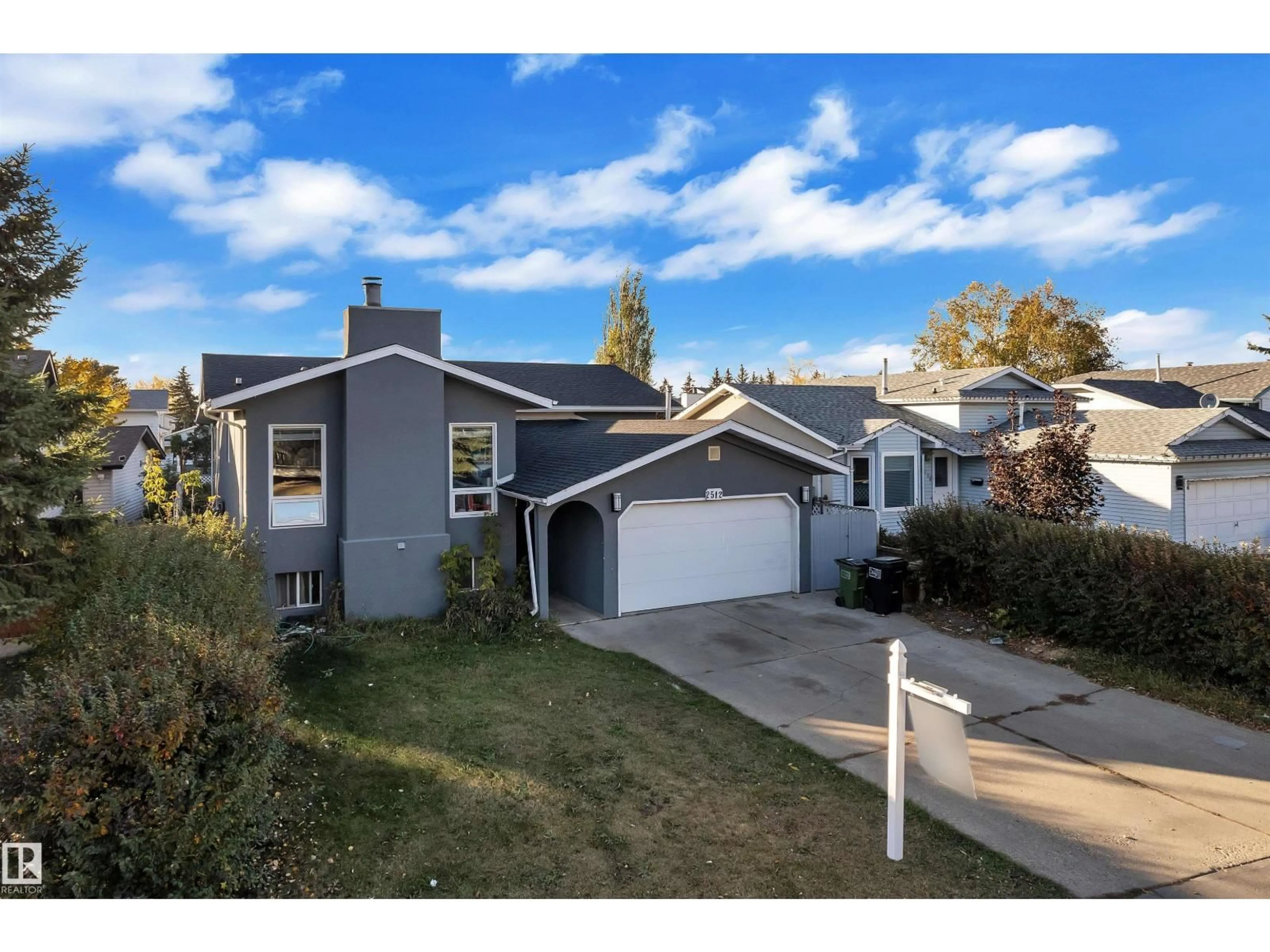 Home with vinyl exterior material, street for 2512 42 ST, Edmonton Alberta T5L4M8