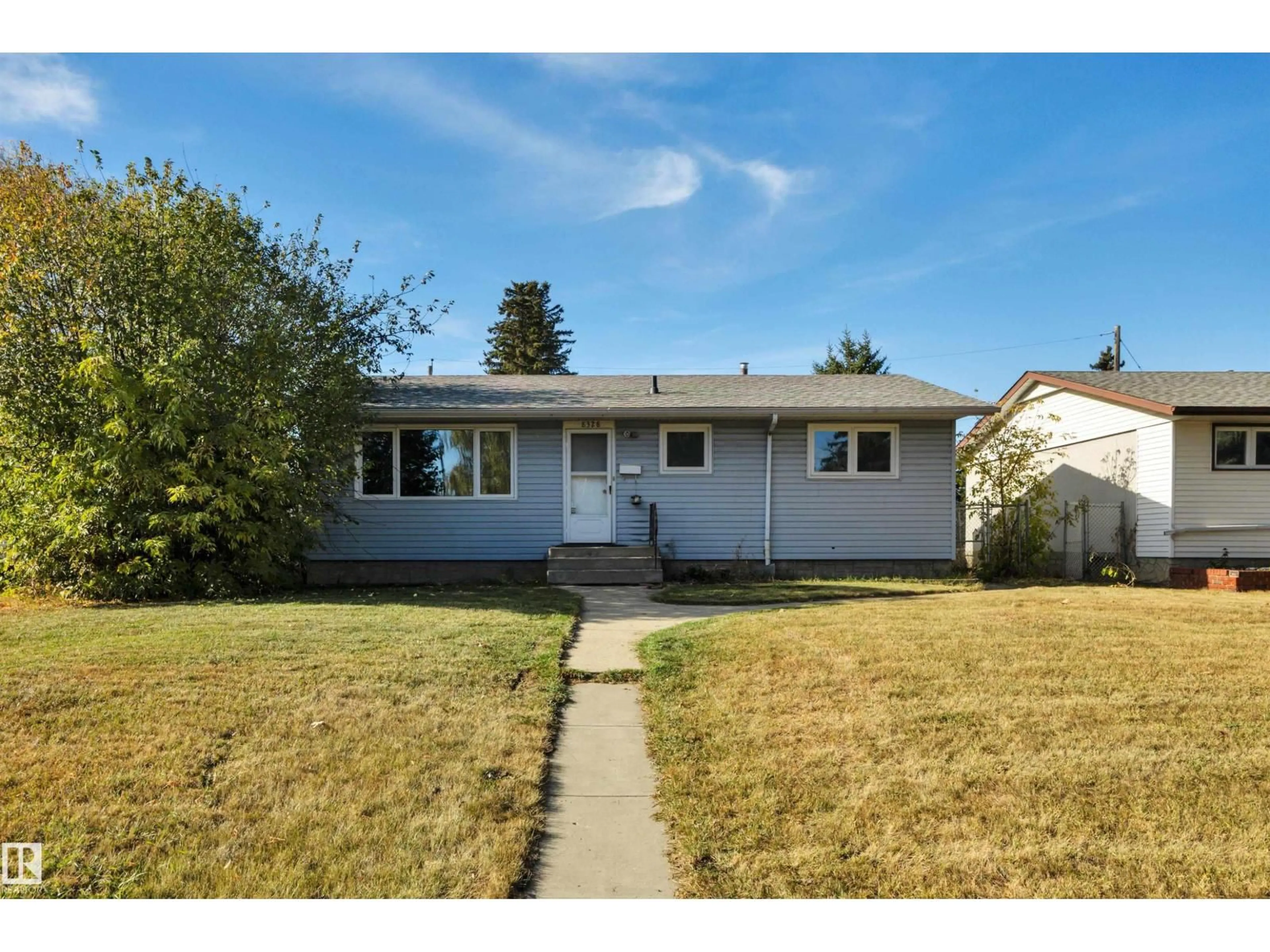 Home with vinyl exterior material, street for NW - 8328 165 ST, Edmonton Alberta T5R2R4