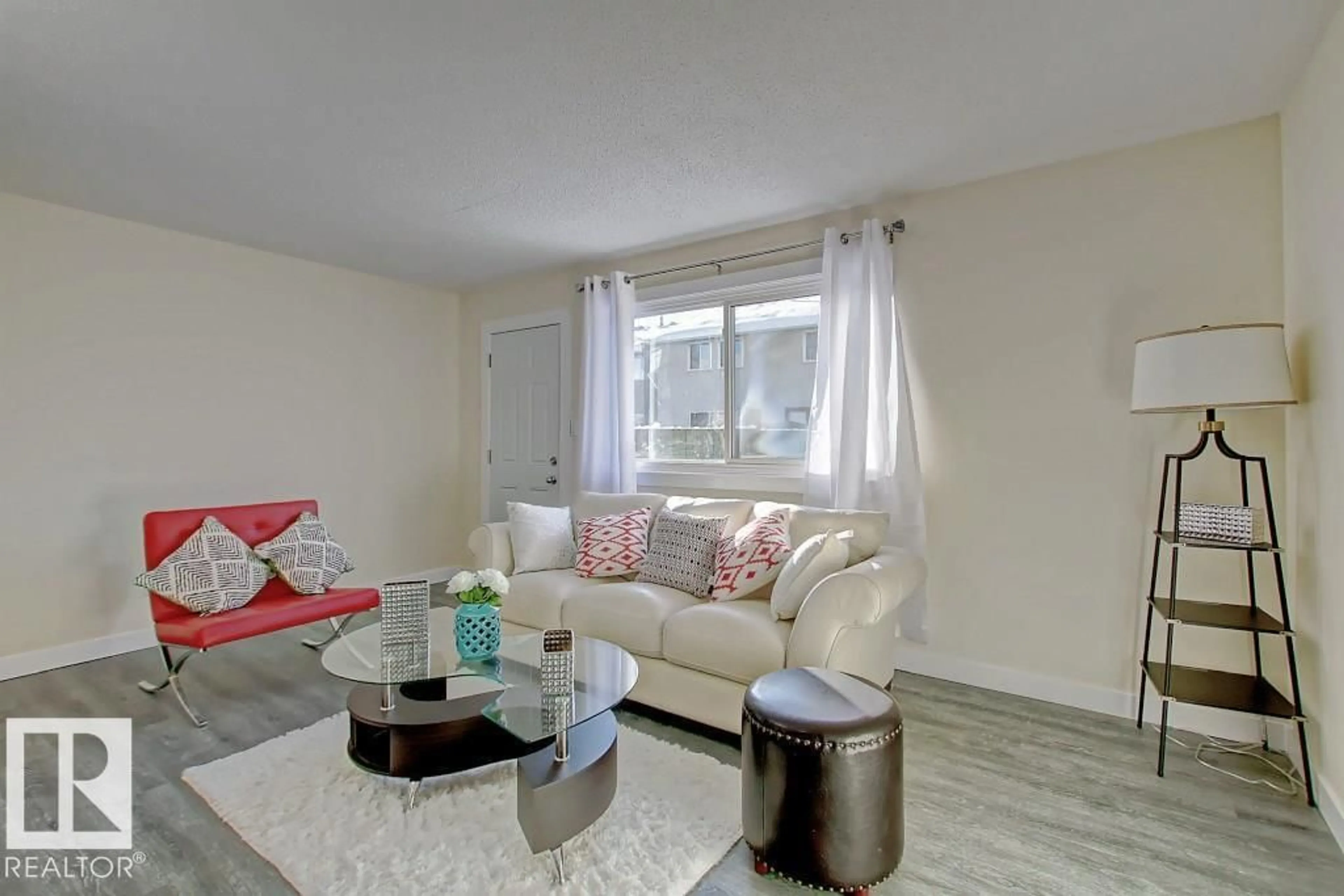 Living room with furniture, wood/laminate floor for 692 ABBOTTSFIELD RD, Edmonton Alberta T5W4R4