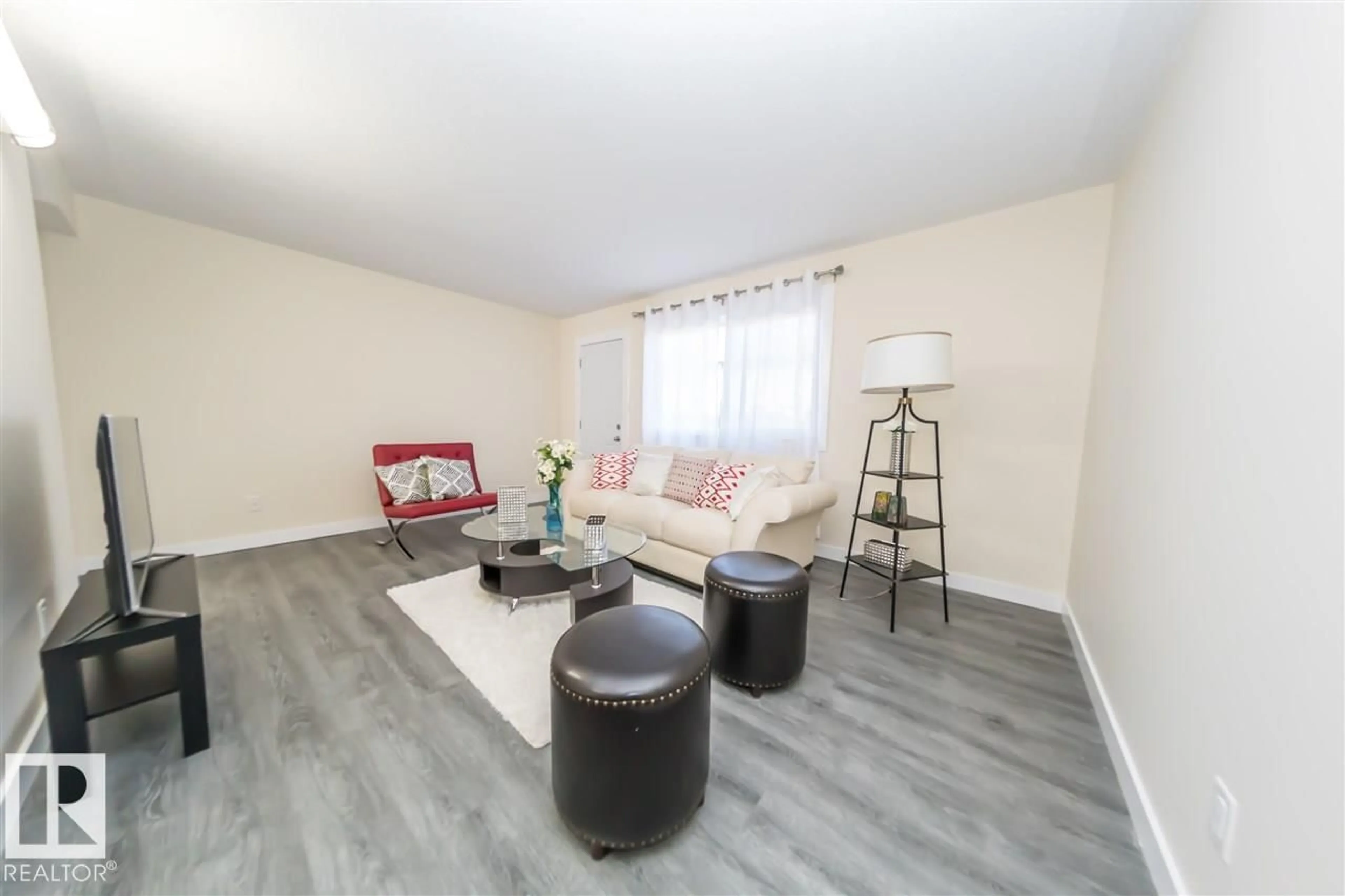 Living room with furniture, wood/laminate floor for 692 ABBOTTSFIELD RD, Edmonton Alberta T5W4R4