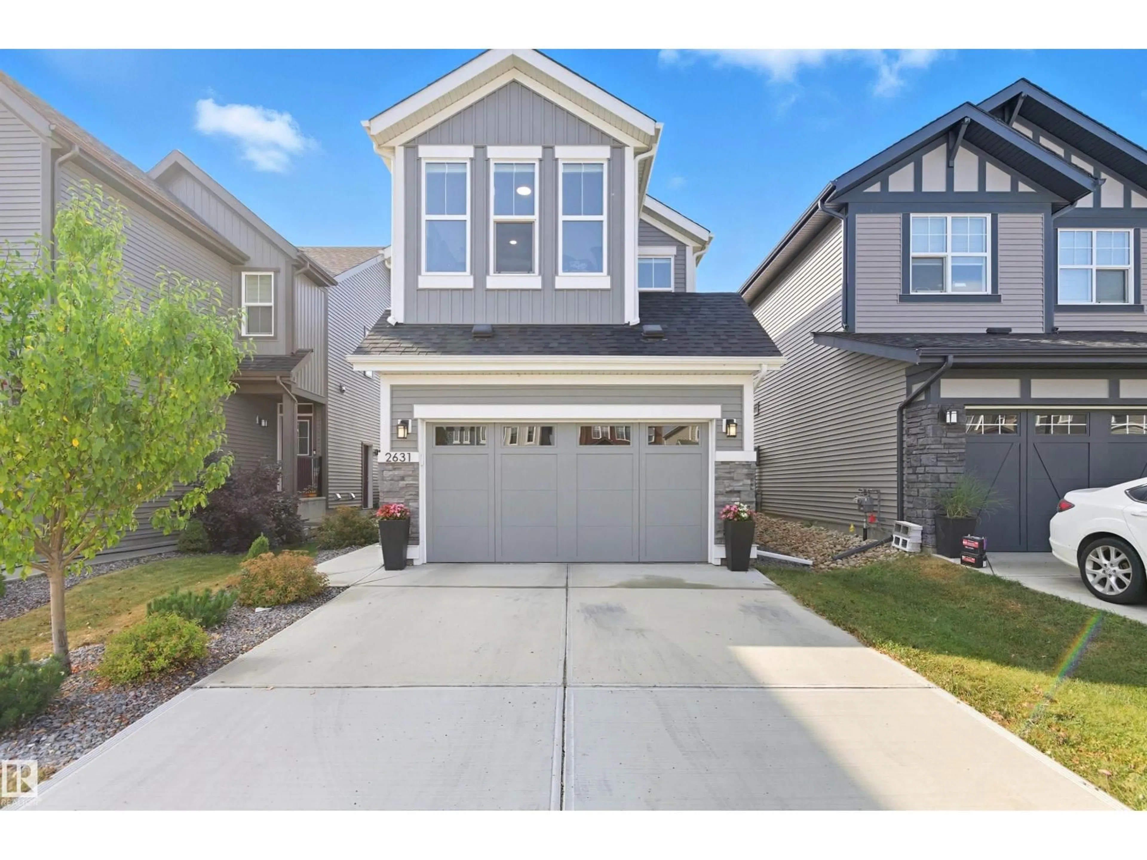 Home with vinyl exterior material, street for 2631 DONAGHEY CR, Edmonton Alberta T6W4T2