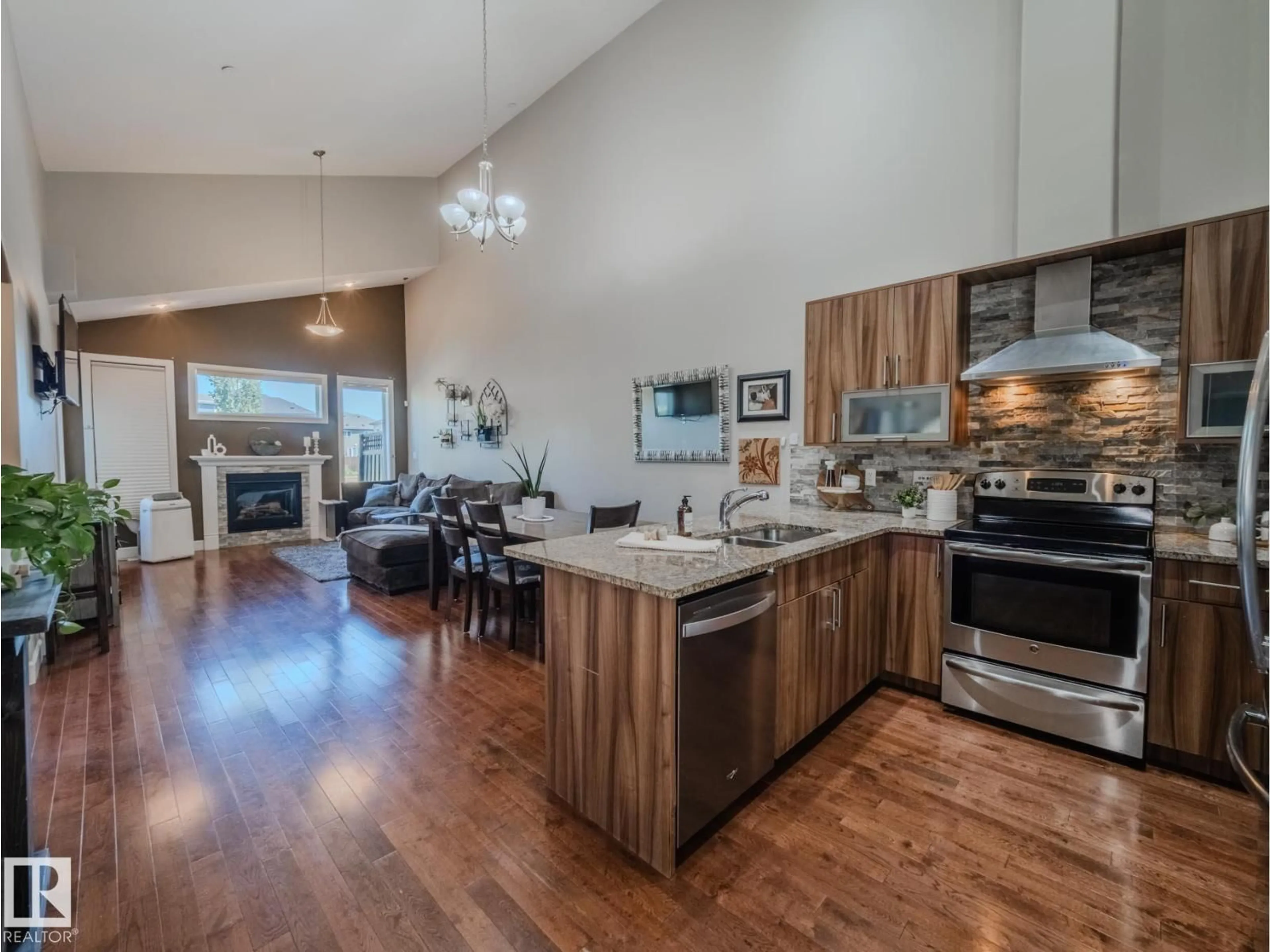 Open concept kitchen, wood/laminate floor for 6612 34 AV, Beaumont Alberta T4X0W7