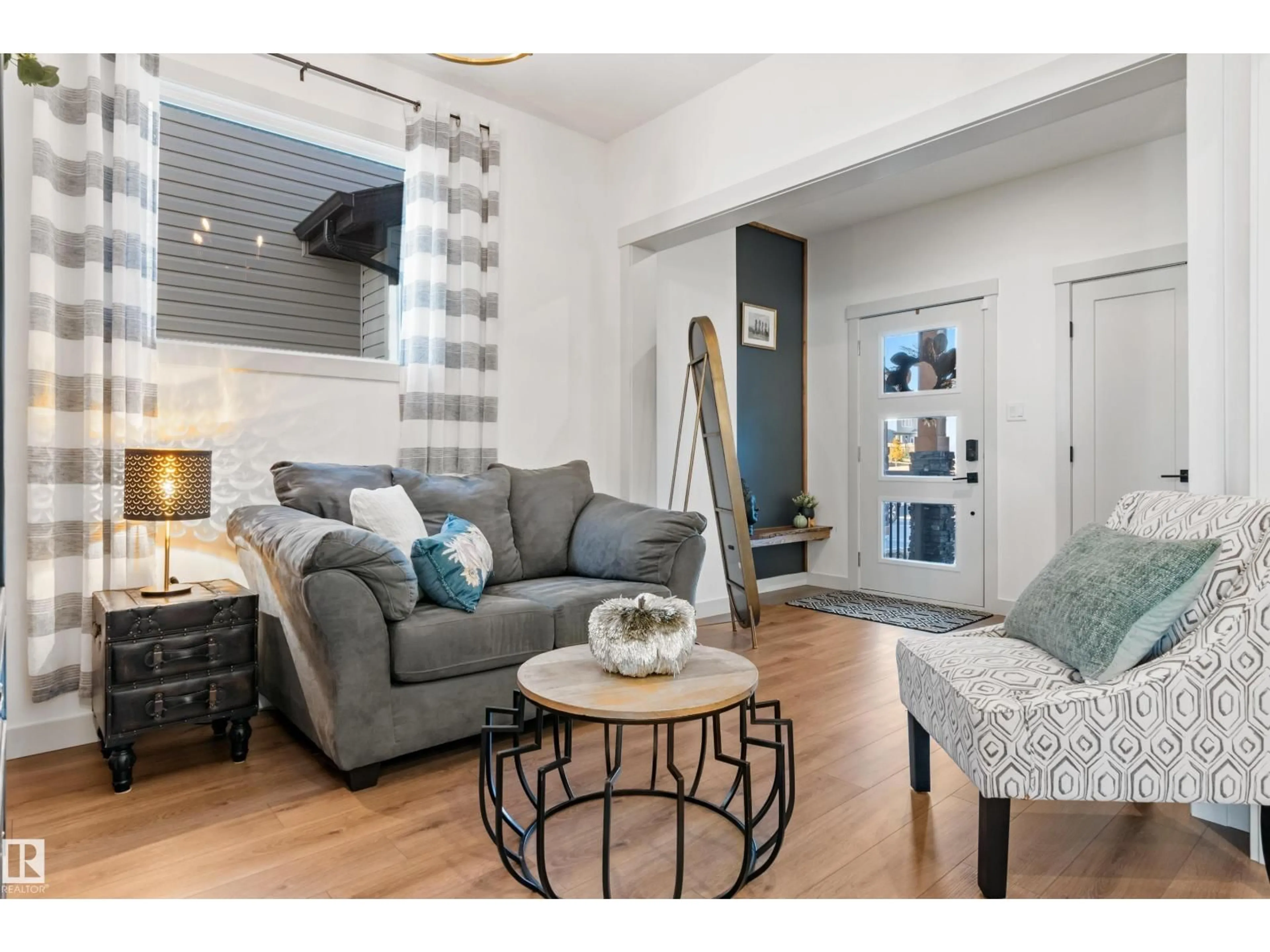 Living room with furniture, wood/laminate floor for 57 SAVOY CR, Sherwood Park Alberta T8H2Y3