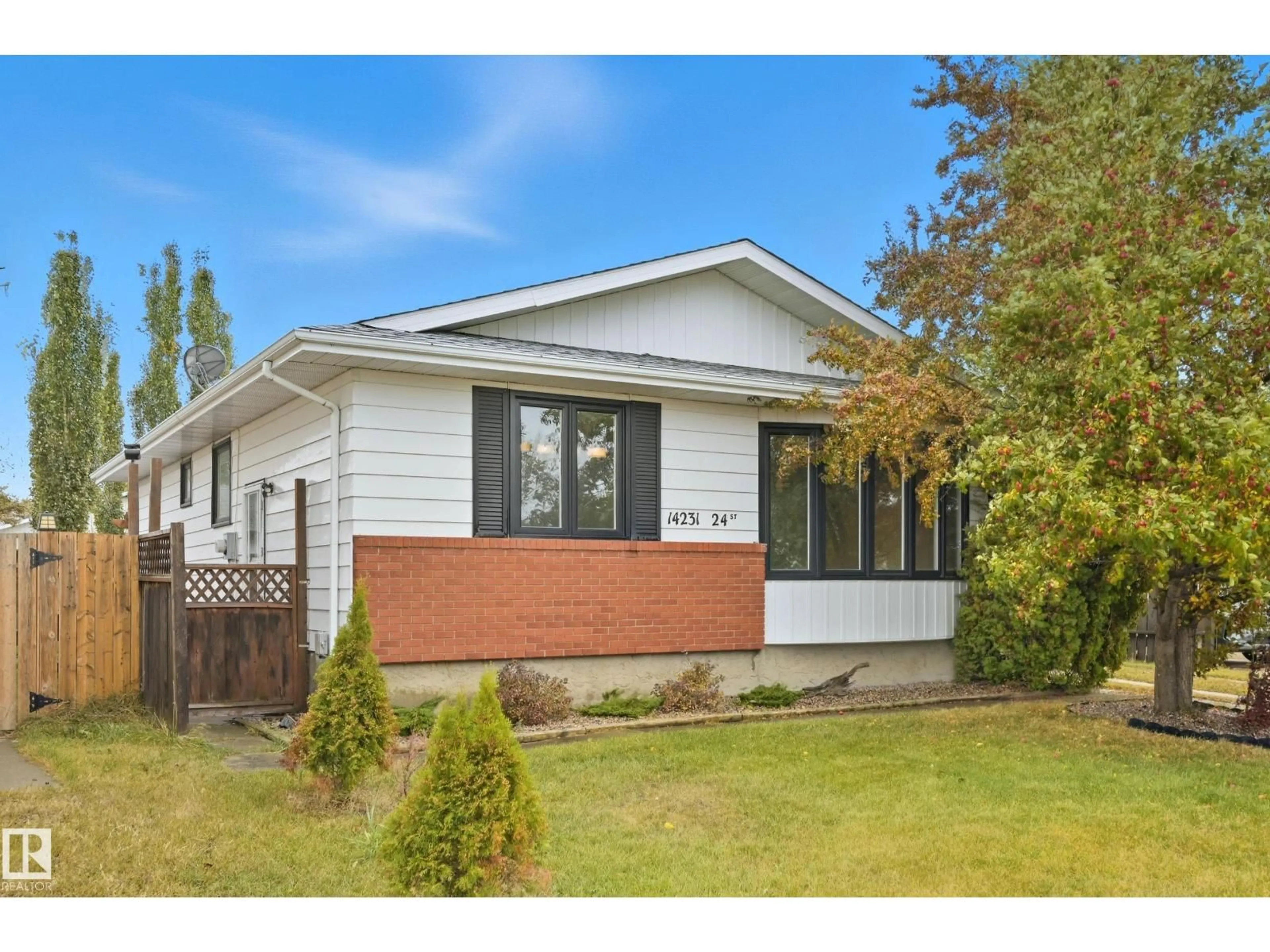 Home with vinyl exterior material, street for 14231 24 ST, Edmonton Alberta T5Y1G2