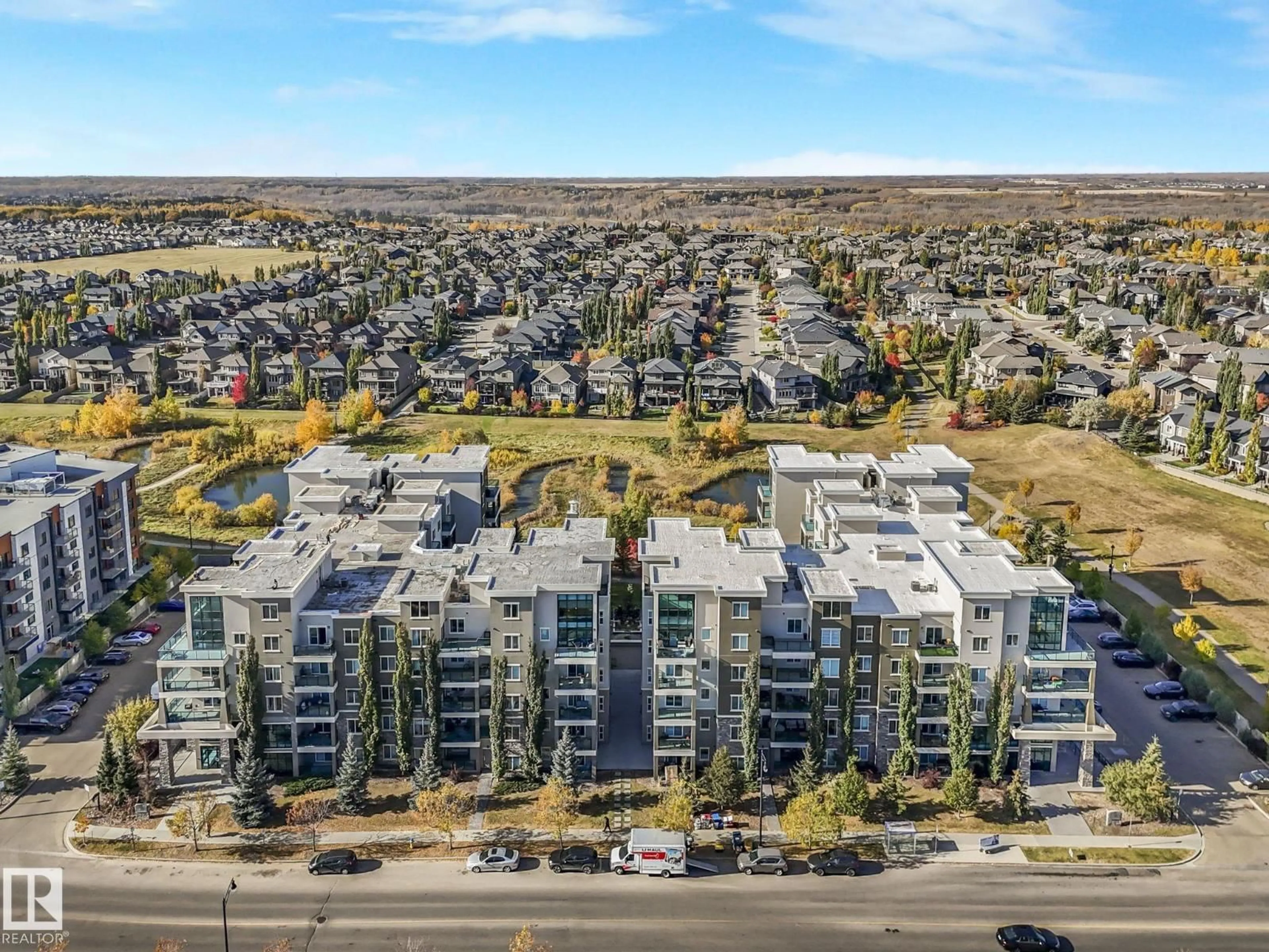 A pic from outside/outdoor area/front of a property/back of a property/a pic from drone, unknown for #212 - 1238 WINDERMERE WY, Edmonton Alberta T6W2J3