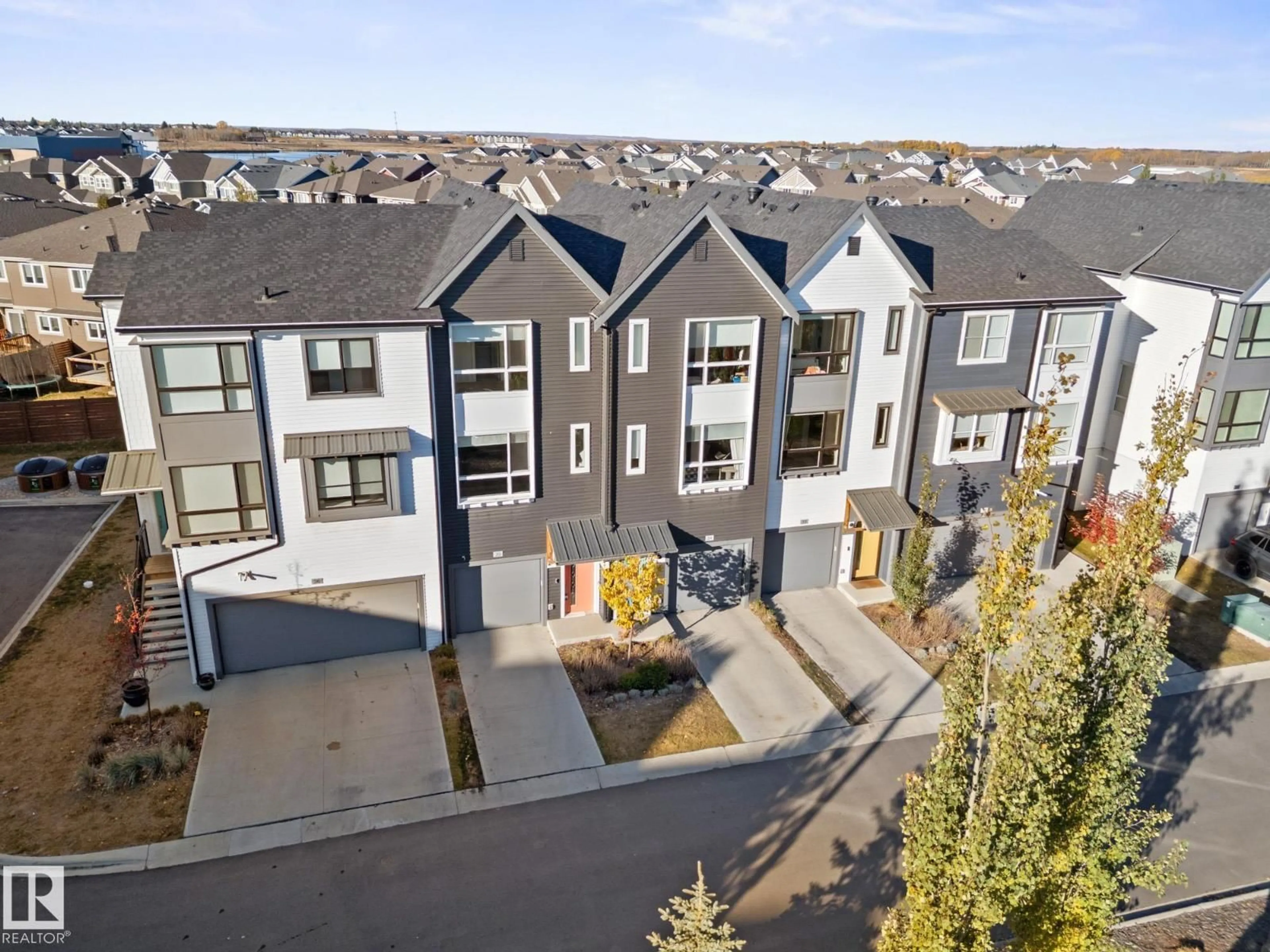 A pic from outside/outdoor area/front of a property/back of a property/a pic from drone, mountain view for 35 100 JENSEN LAKES BV, St. Albert Alberta T8N7K9