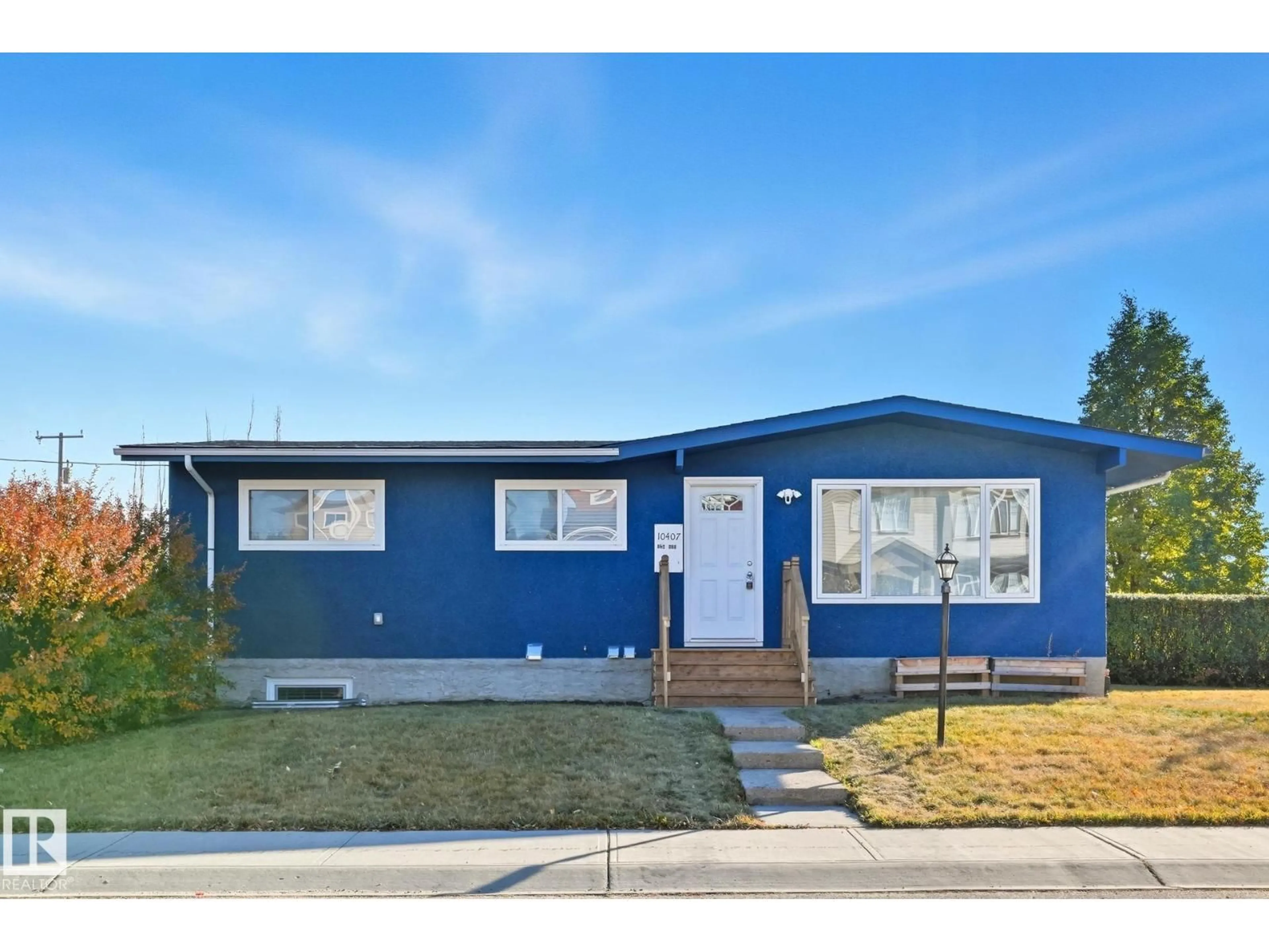 Home with vinyl exterior material, street for 10407 136 AVE, Edmonton Alberta T5E1N2