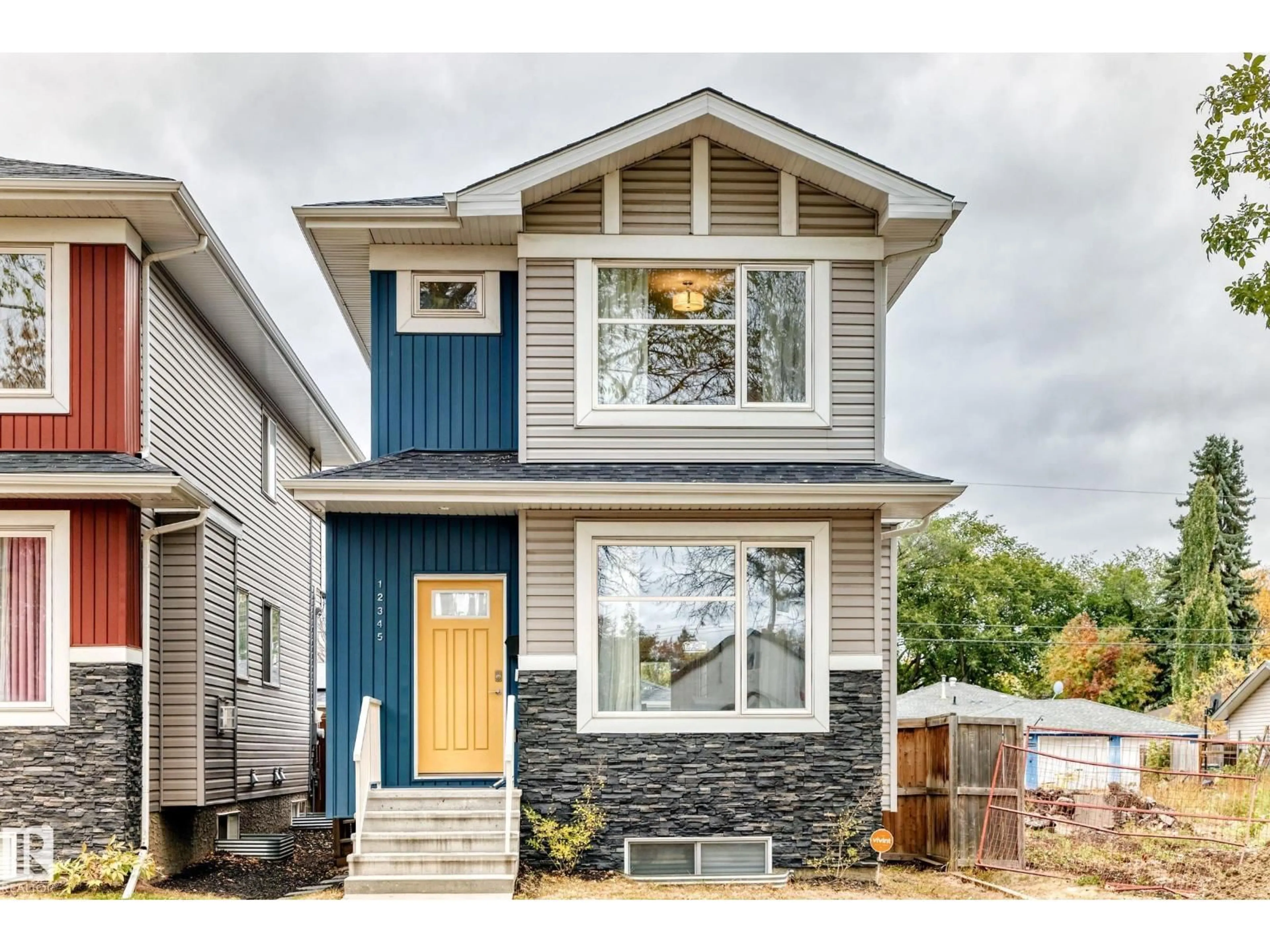 Home with vinyl exterior material, street for NW - 12345 85 ST, Edmonton Alberta T5B3H1