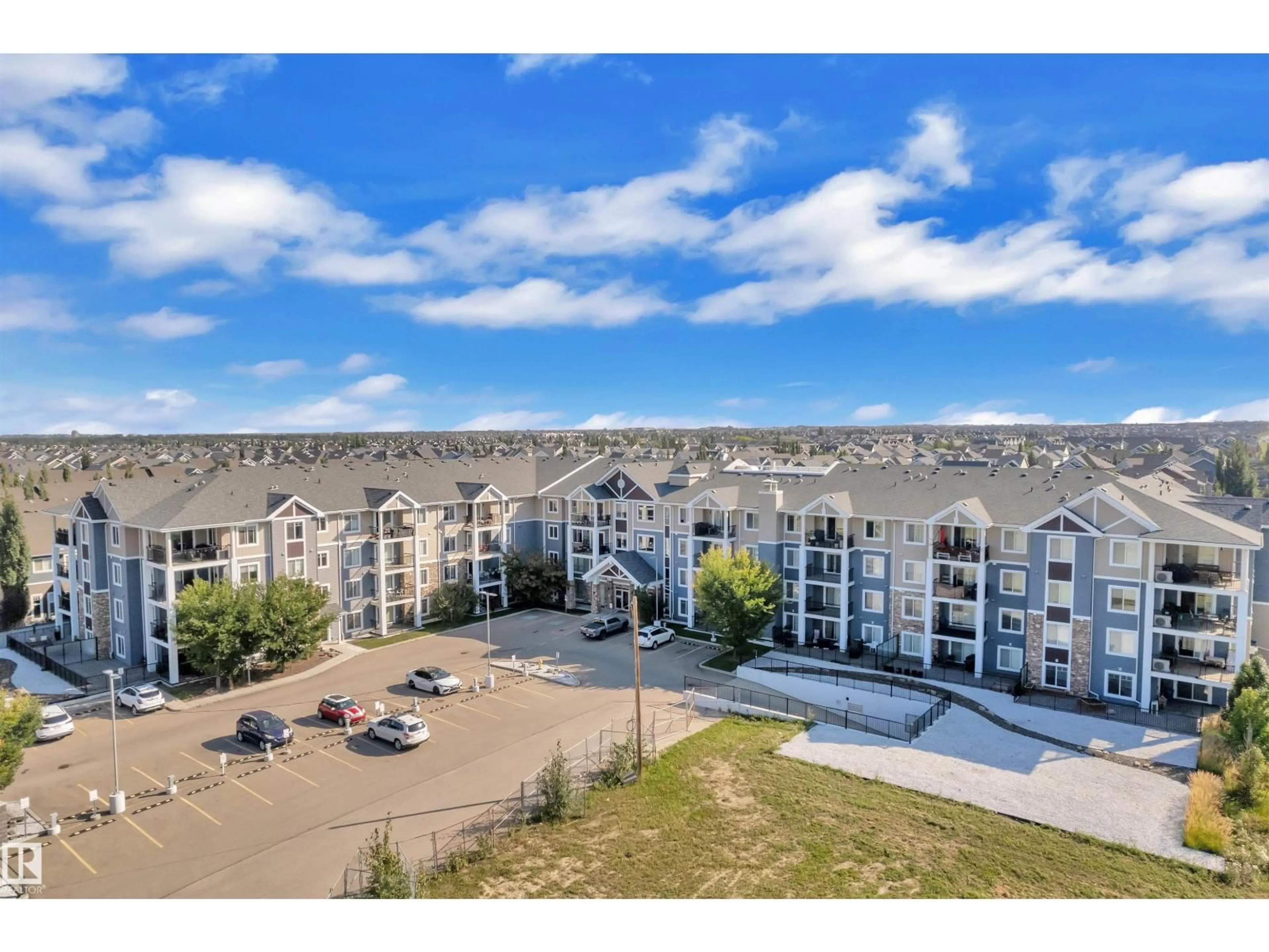 A pic from outside/outdoor area/front of a property/back of a property/a pic from drone, unknown for #106 - 4008 SAVARYN DR, Edmonton Alberta T6X2E5