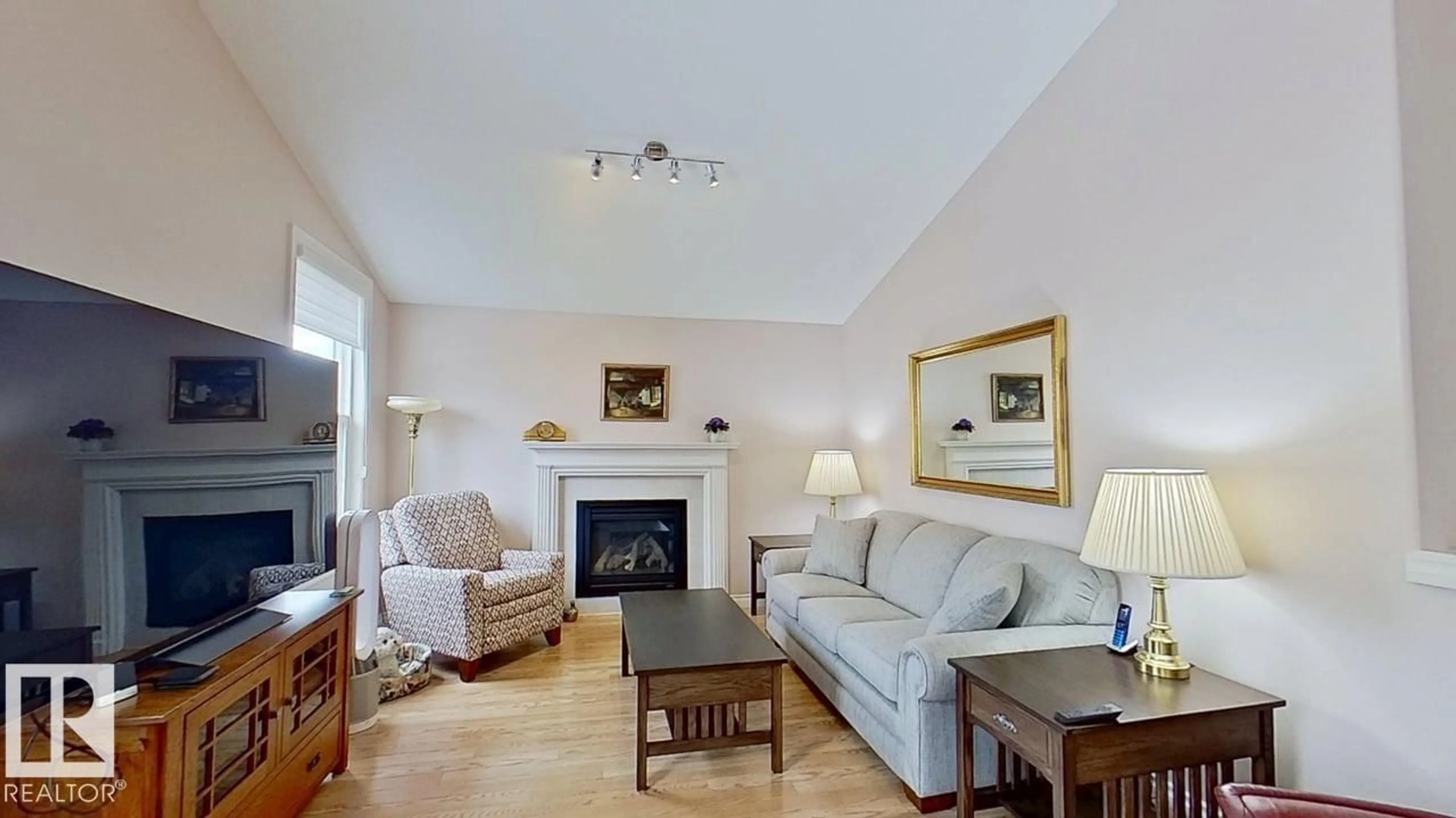 Living room with furniture, wood/laminate floor for NW - 13040 164 AV, Edmonton Alberta T6V0E7