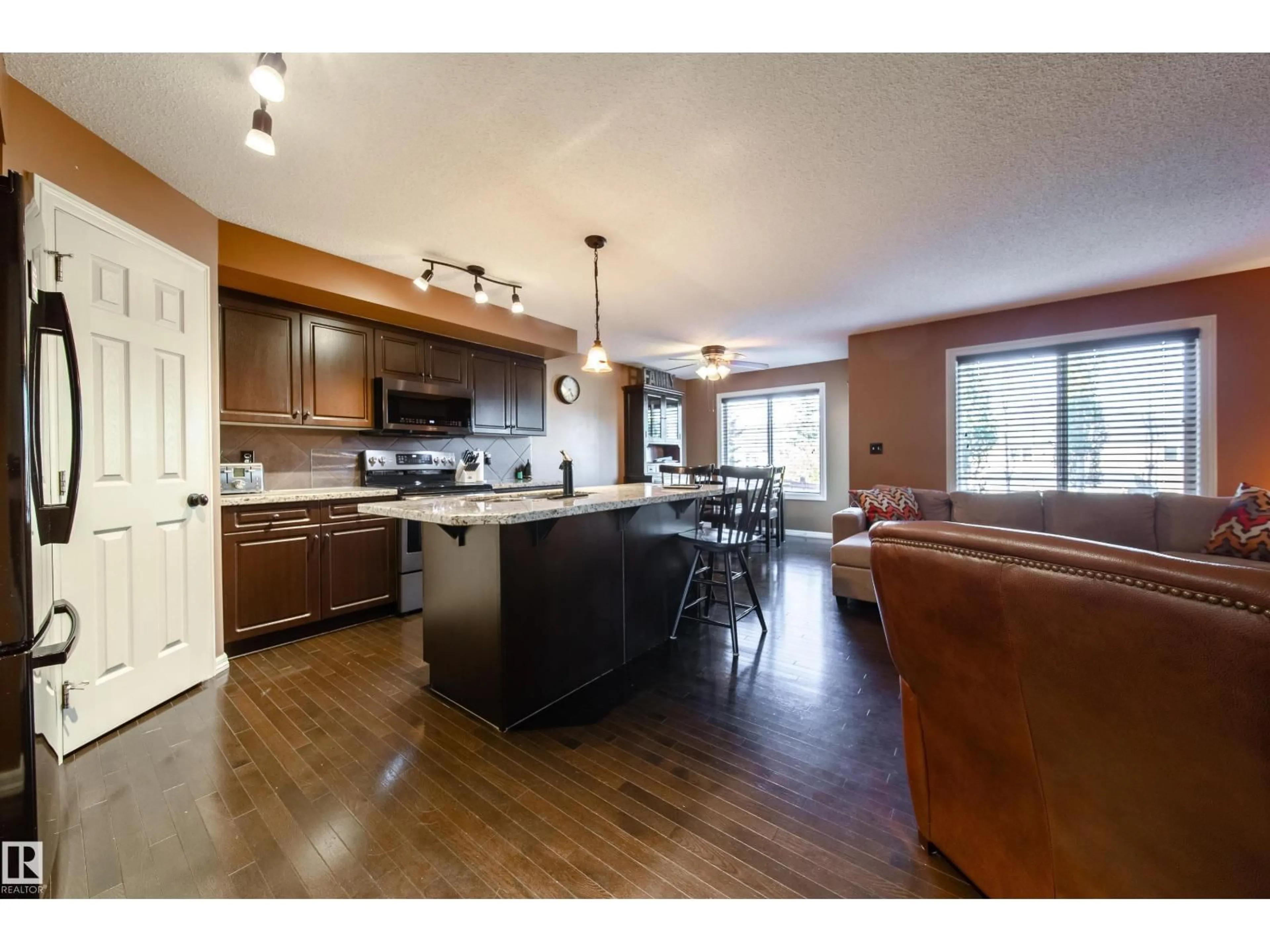 Open concept kitchen, wood/laminate floor for 173 RUE MONIQUE, Beaumont Alberta T4Z0A1