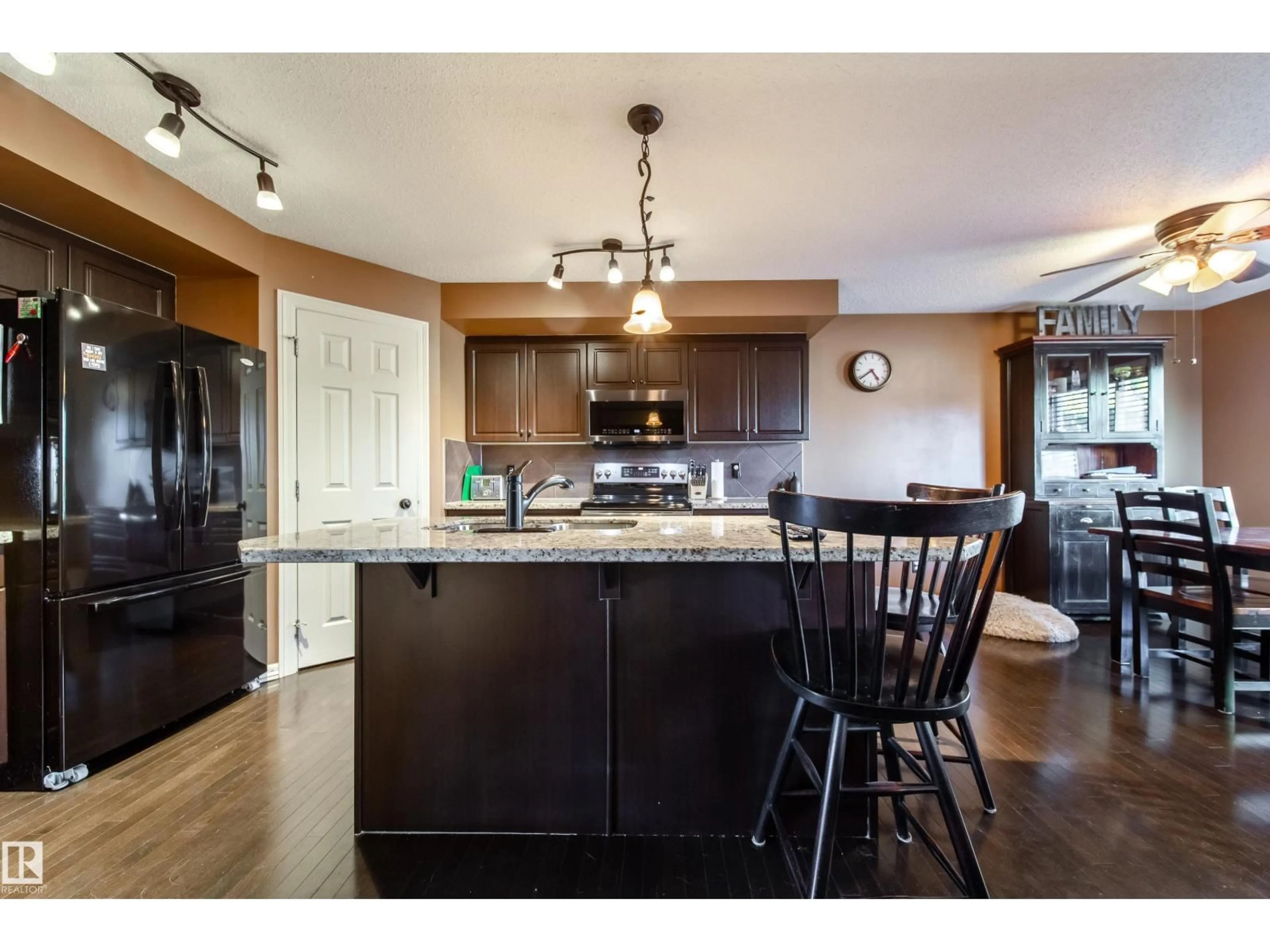 Open concept kitchen, wood/laminate floor for 173 RUE MONIQUE, Beaumont Alberta T4Z0A1
