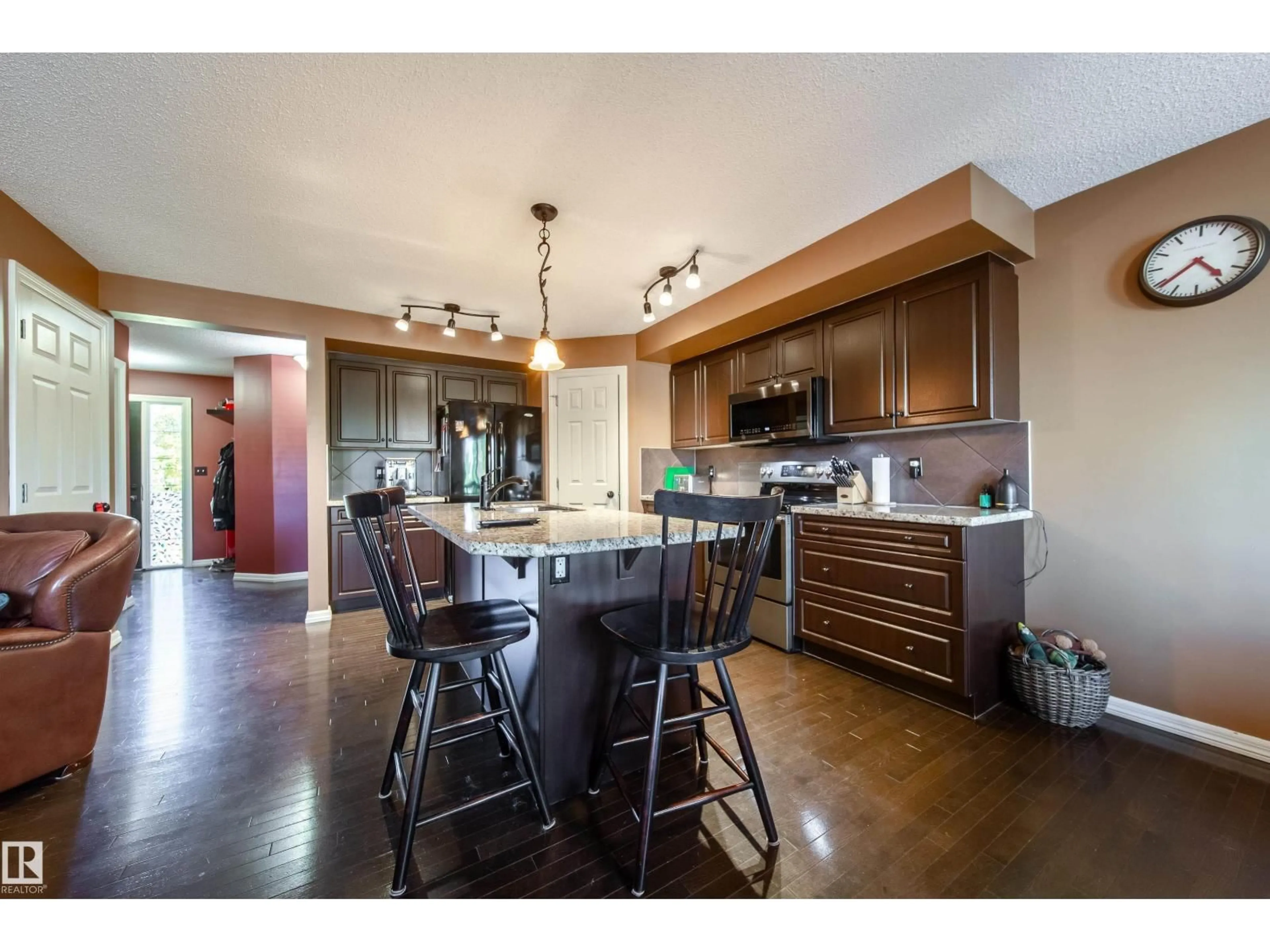 Open concept kitchen, wood/laminate floor for 173 RUE MONIQUE, Beaumont Alberta T4Z0A1