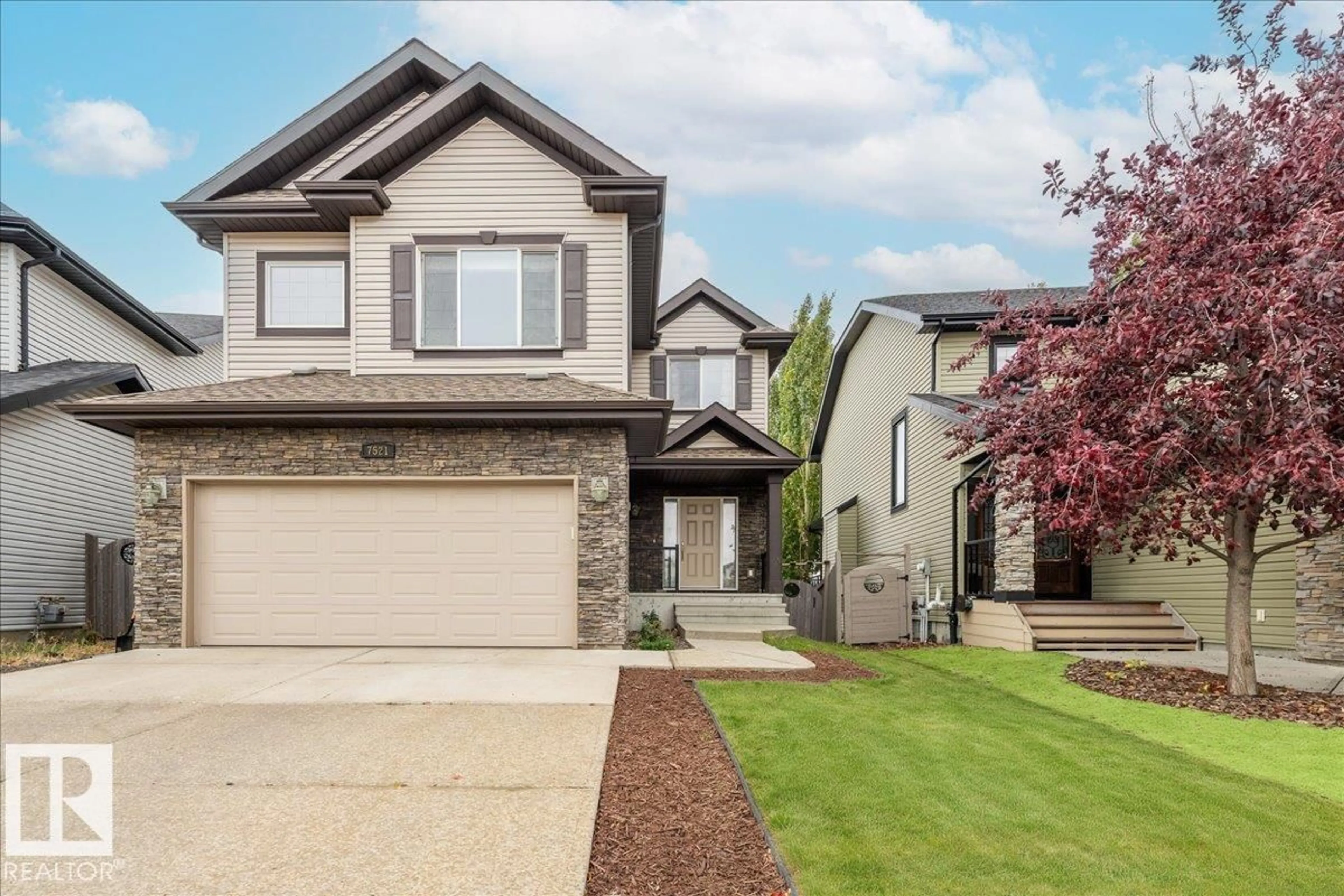 Home with vinyl exterior material, street for 7521 SPEAKER WY, Edmonton Alberta T6R0P2