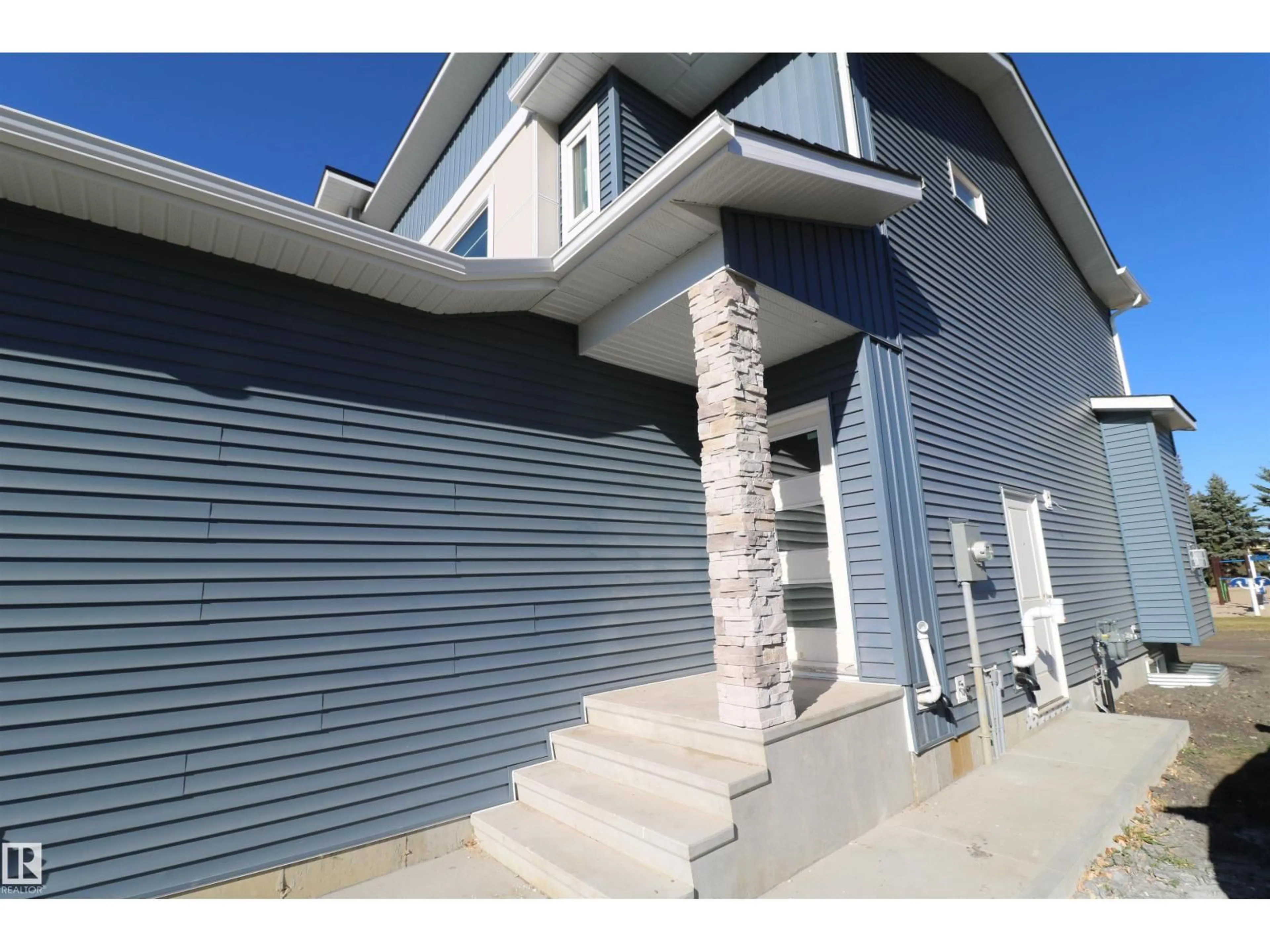 Home with vinyl exterior material, street for 4904 49 AV, Gibbons Alberta T0A1N0