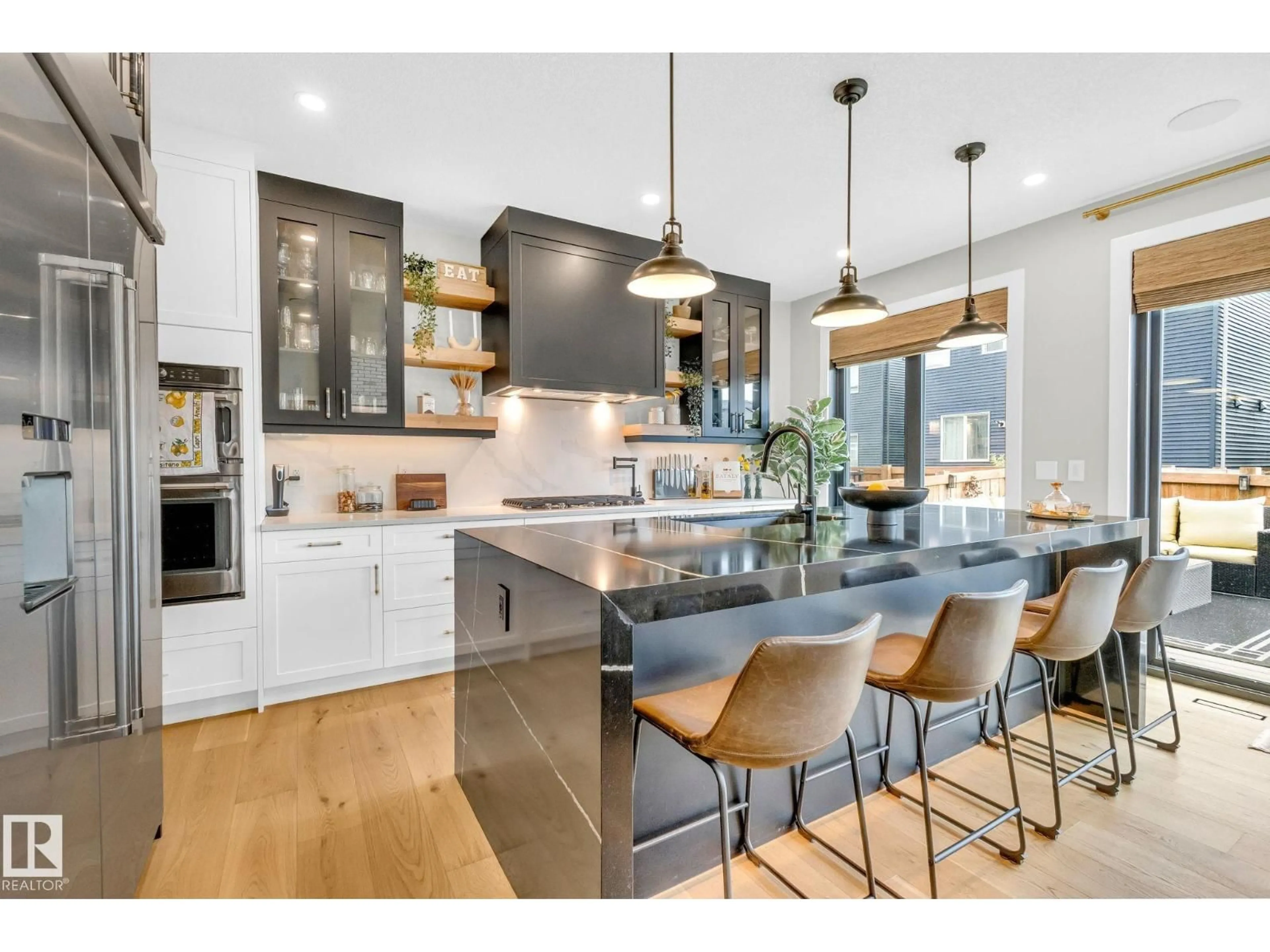 Open concept kitchen, wood/laminate floor for 5548 KOOTOOK DR, Edmonton Alberta T6W4W1