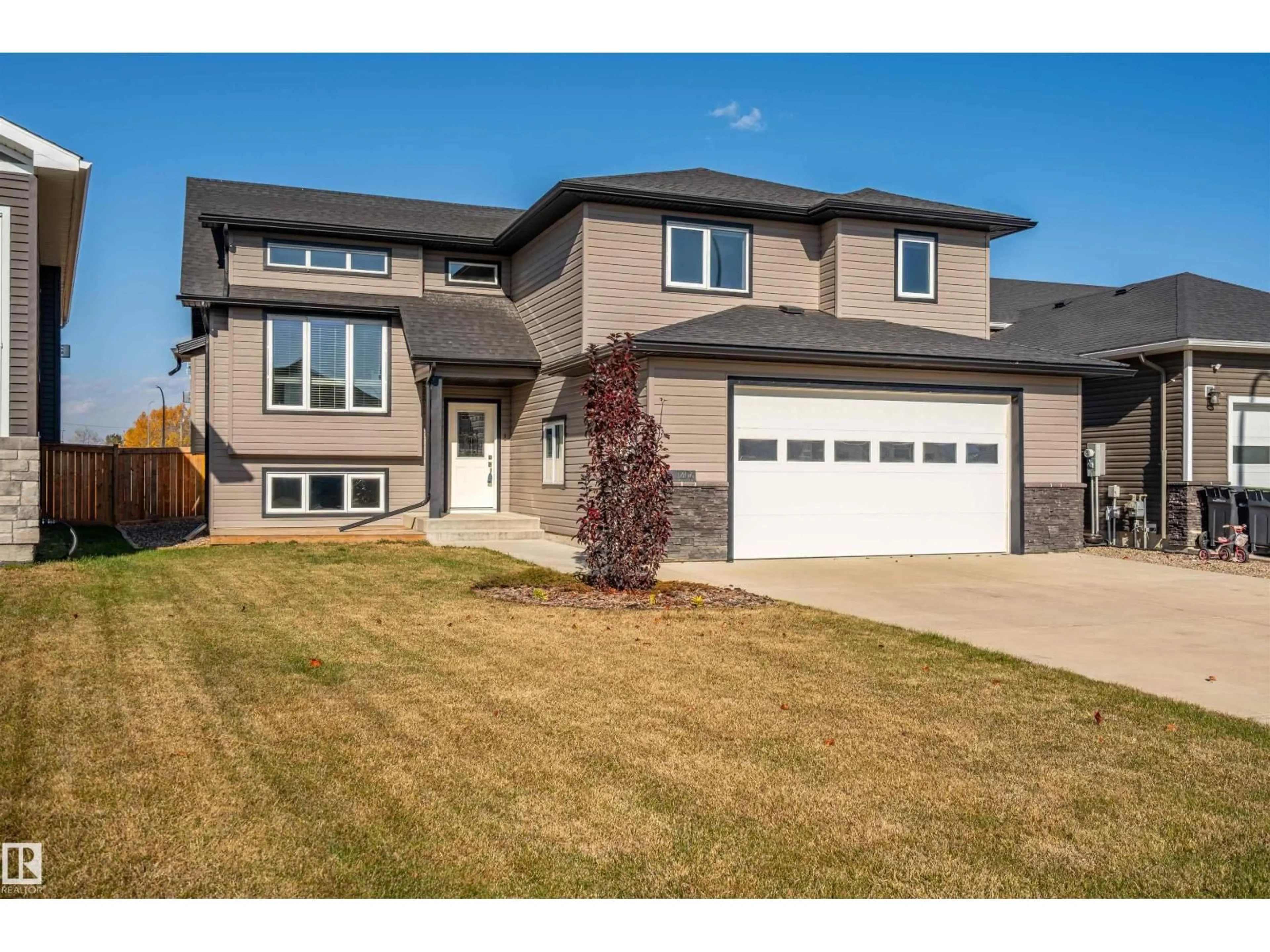 Home with vinyl exterior material, street for 1406 18 AV, Cold Lake Alberta T9M0G4