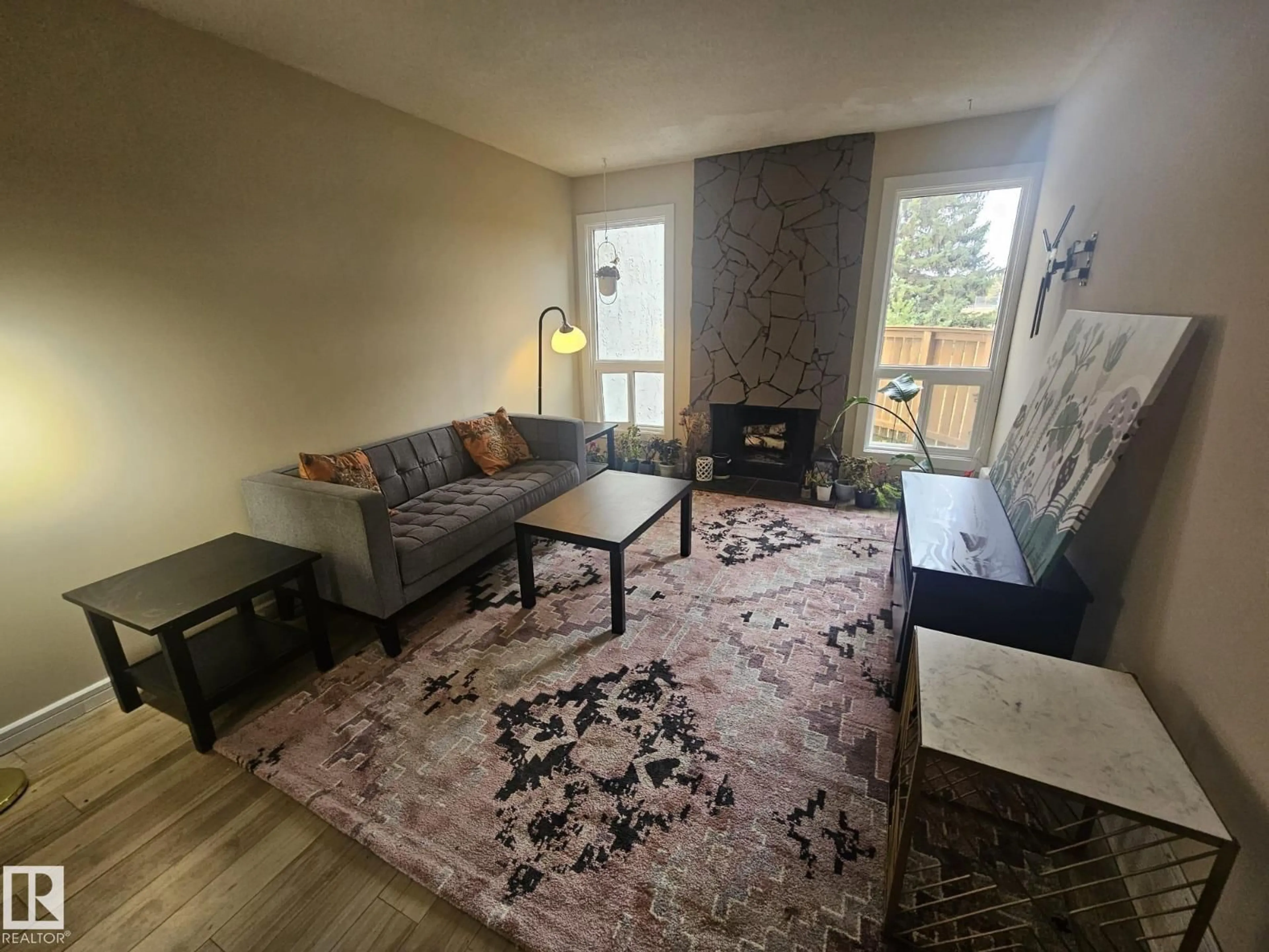 Living room with furniture, wood/laminate floor for 6010 MILL WOODS RD S, Edmonton Alberta T6L1N5