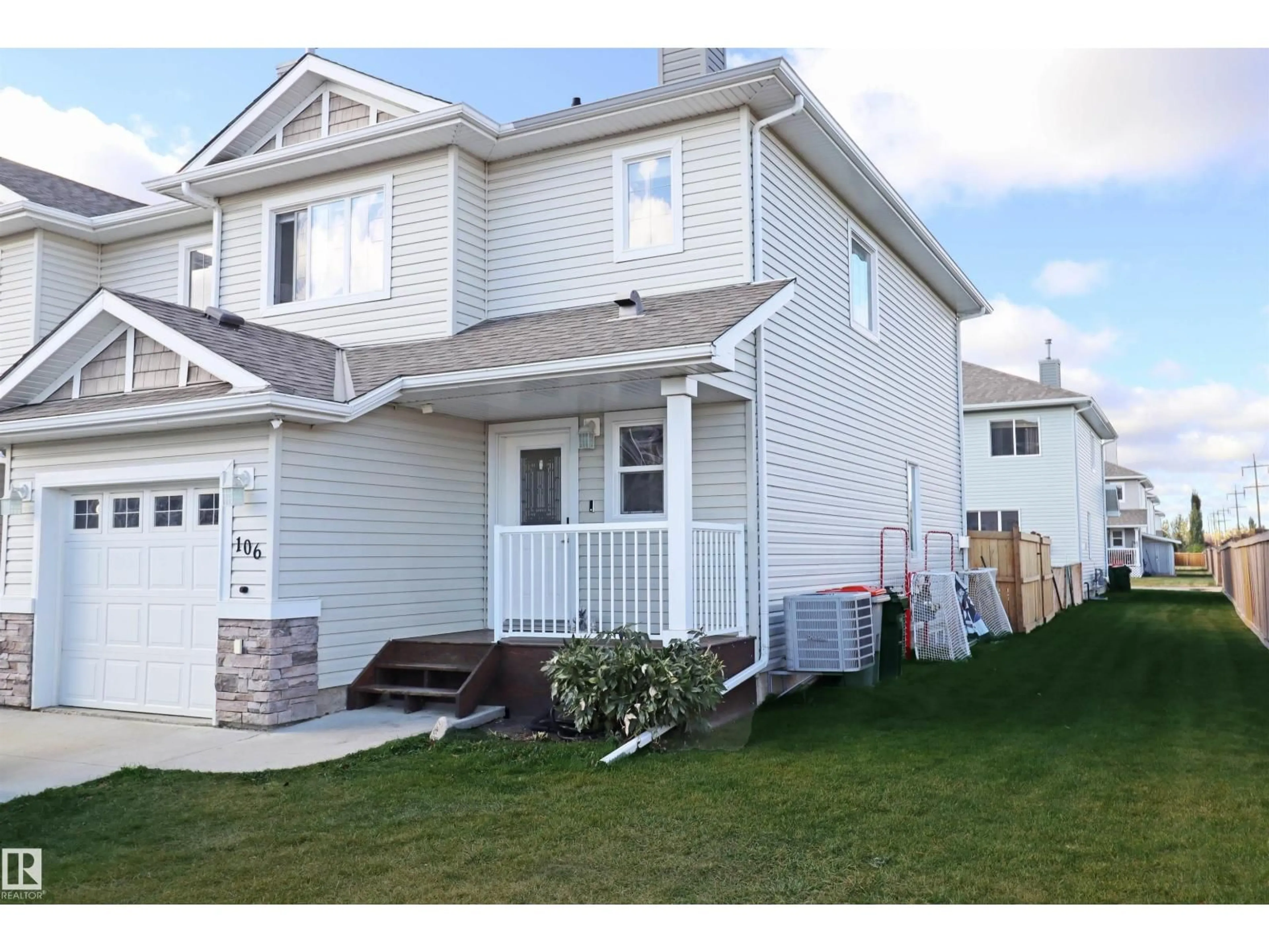 Home with vinyl exterior material, street for 106 GRAYWOOD ME, Stony Plain Alberta T7Z0C2
