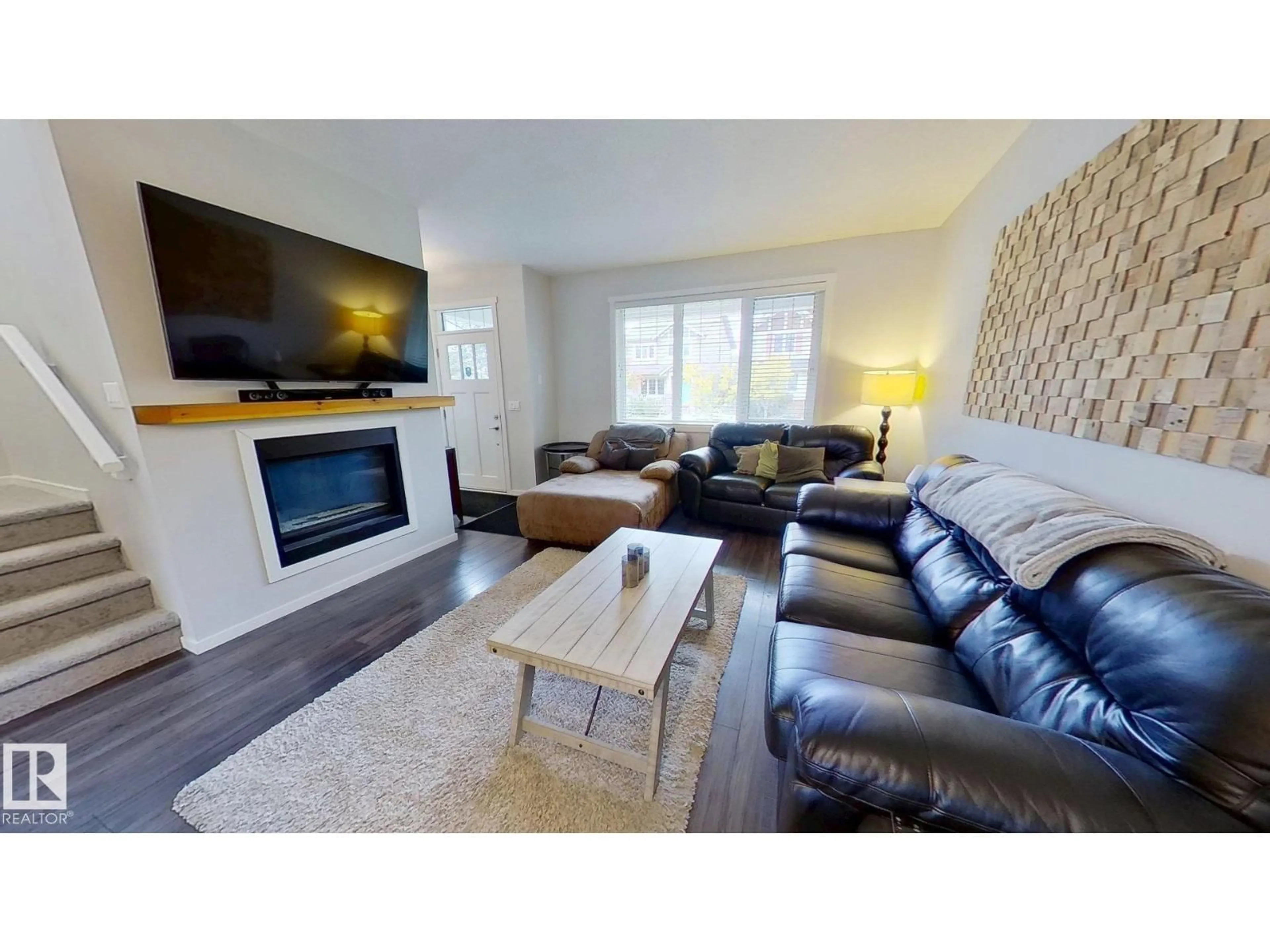 Living room with furniture, wood/laminate floor for 3456 CUTLER CR, Edmonton Alberta T6W2B3