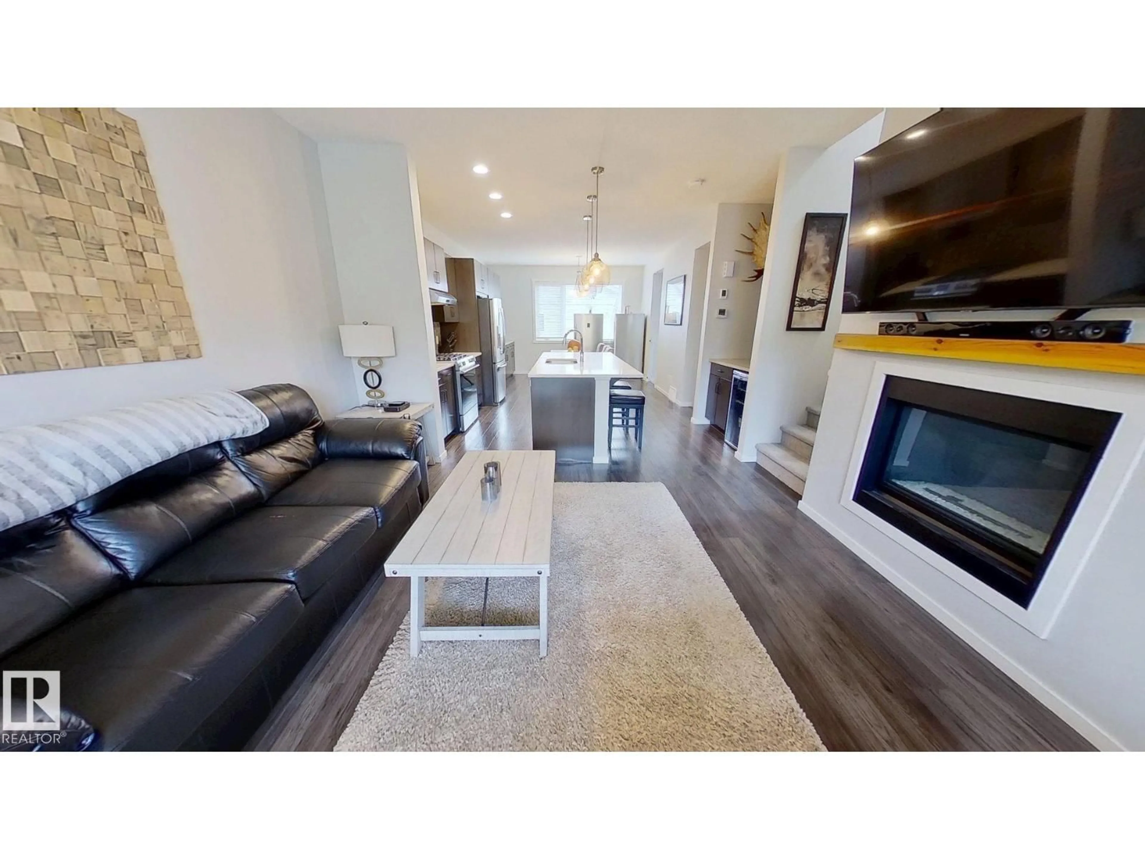 Living room with furniture, wood/laminate floor for 3456 CUTLER CR, Edmonton Alberta T6W2B3
