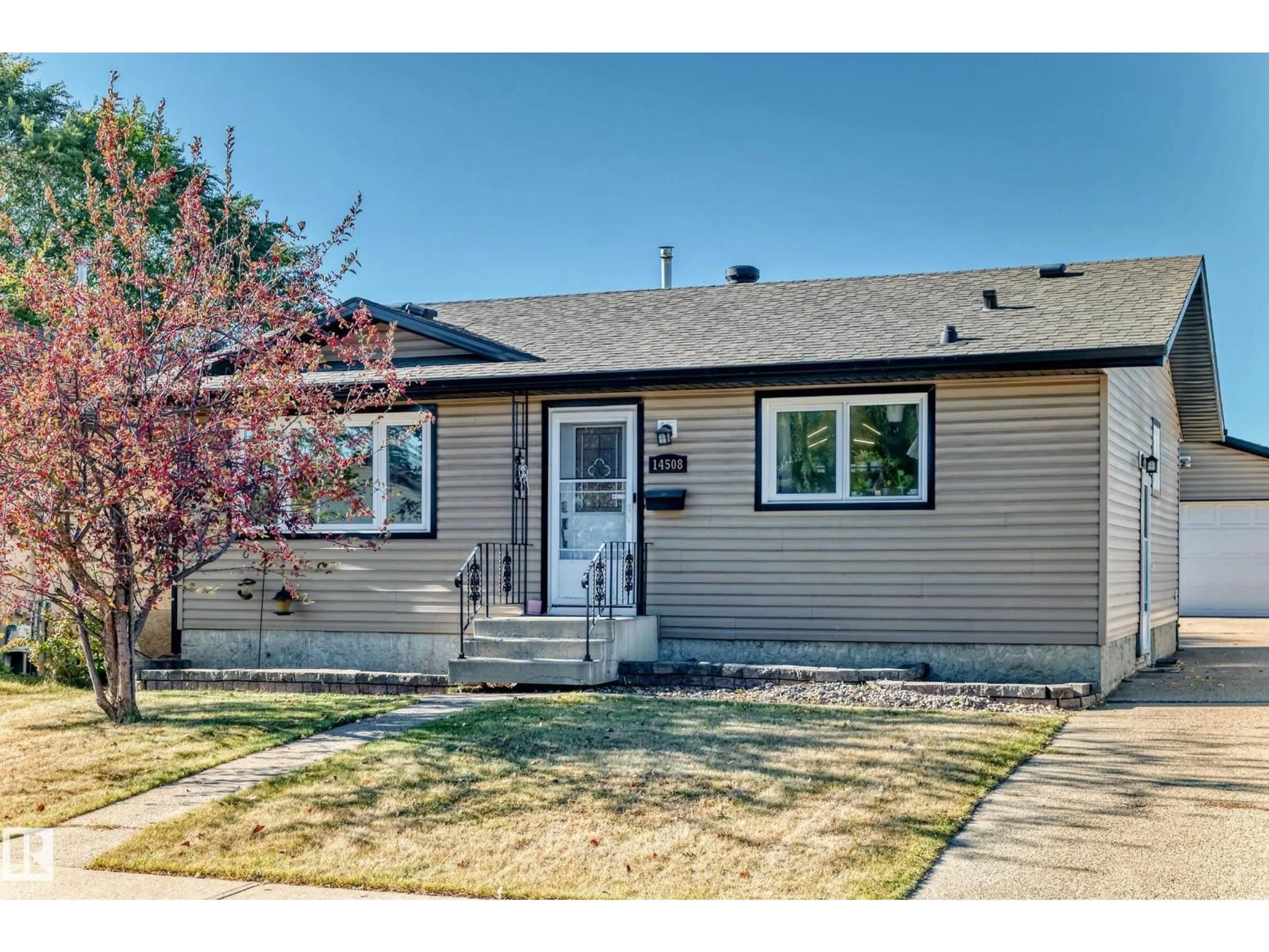Home with vinyl exterior material, street for 14508 21 ST, Edmonton Alberta T5Y1T8