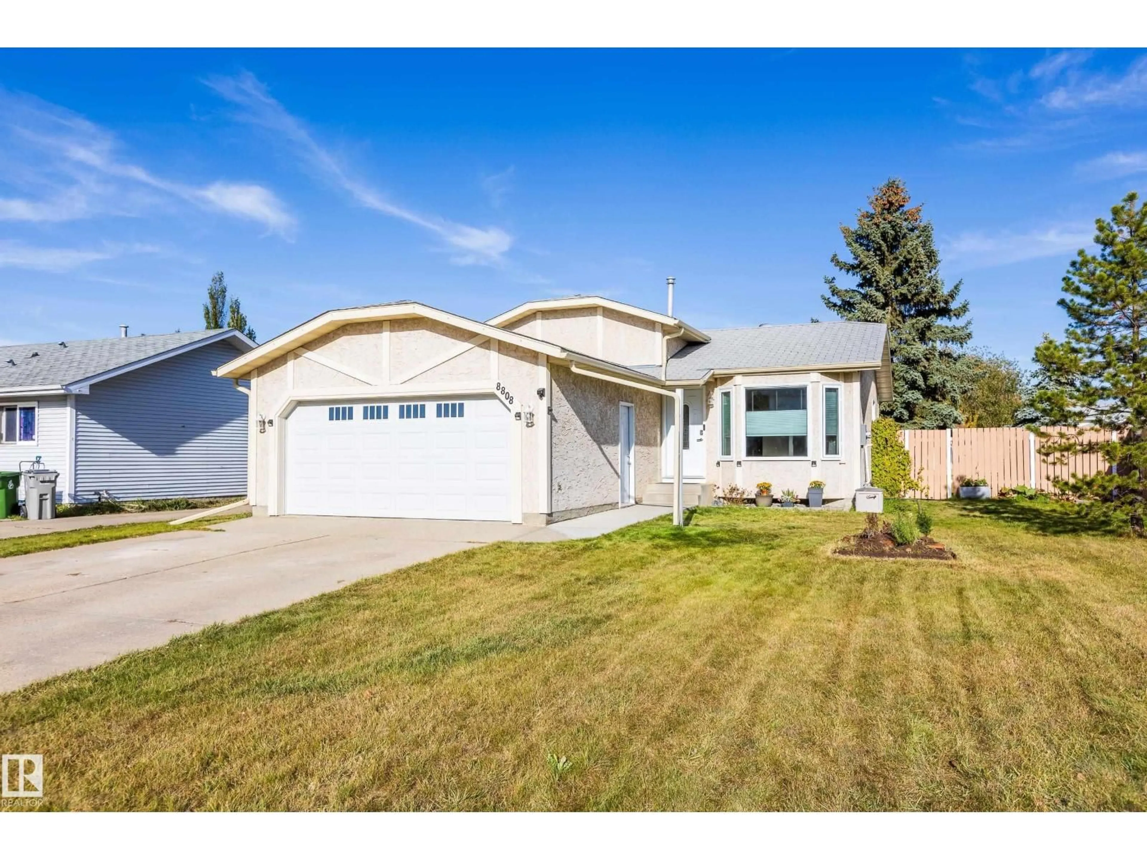 Home with vinyl exterior material, street for 8802 102 AV, Morinville Alberta T8R1B7