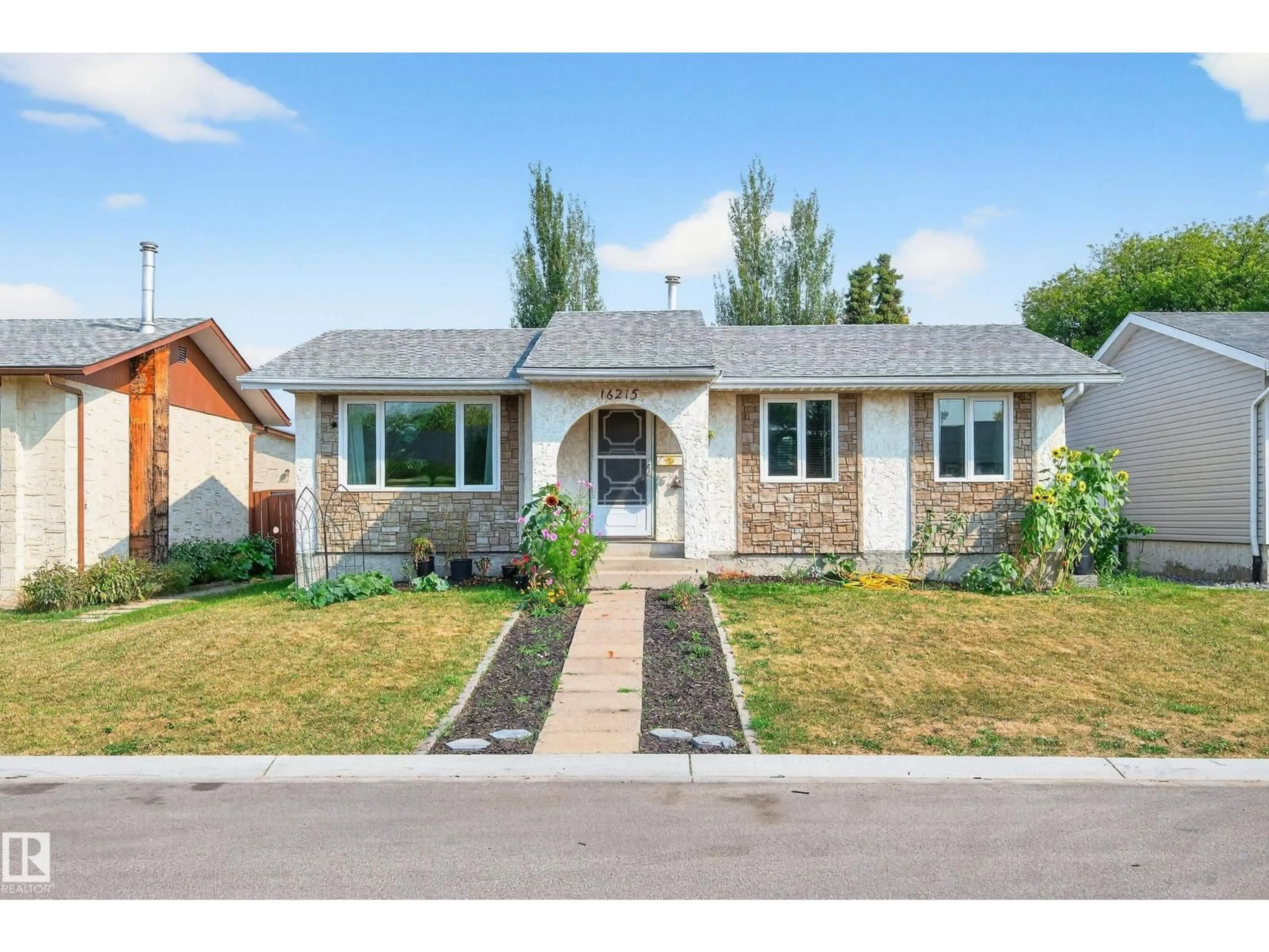 Home with brick exterior material, street for NW - 16215 102 ST, Edmonton Alberta T5X2G8